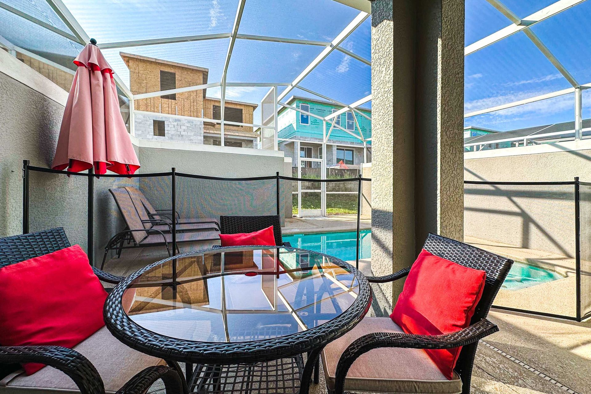 Poolside patio table, offering a perfect spot for leisurely meals and relaxation beside the private pool