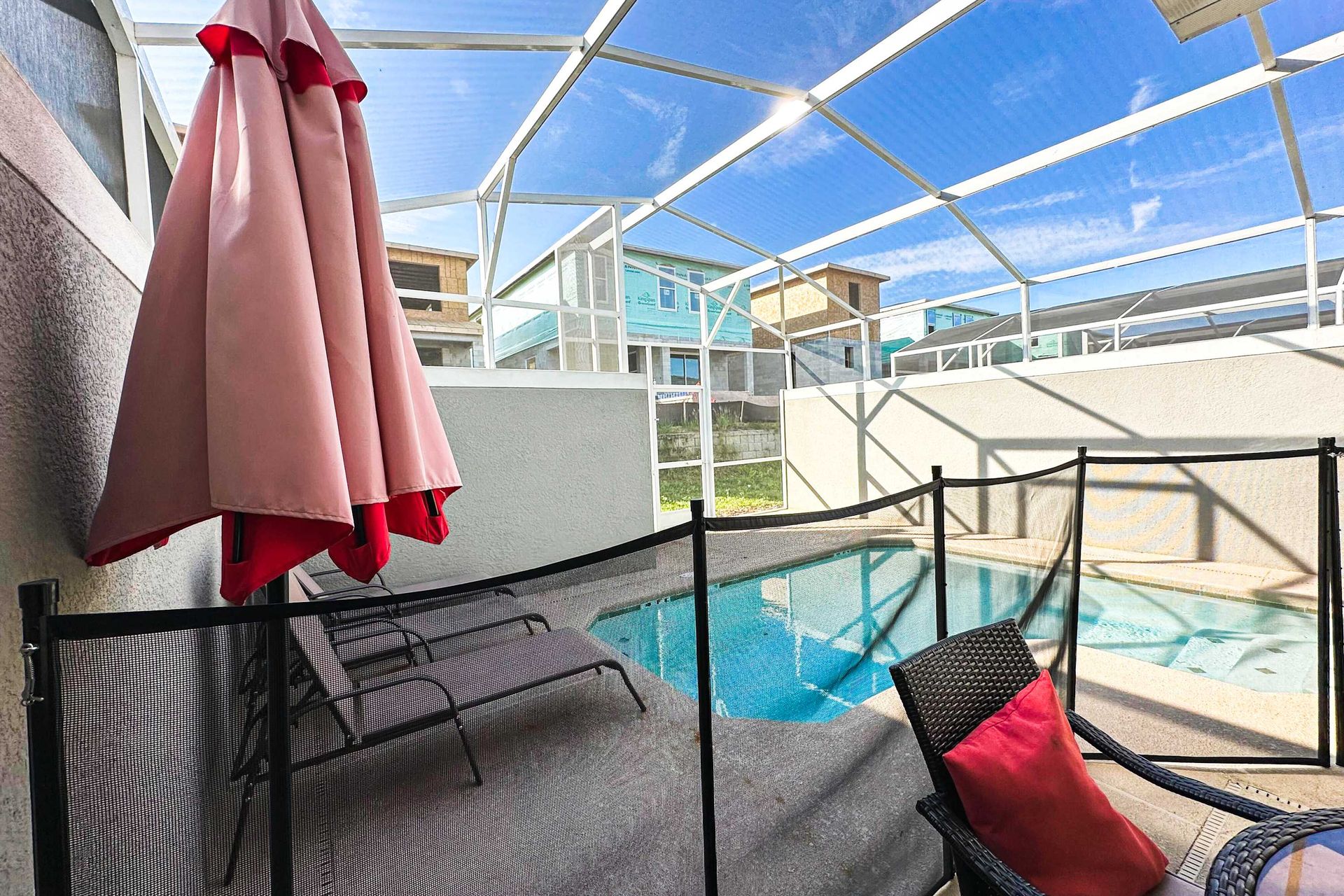 Poolside patio table, offering a perfect spot for leisurely meals and relaxation beside the private pool