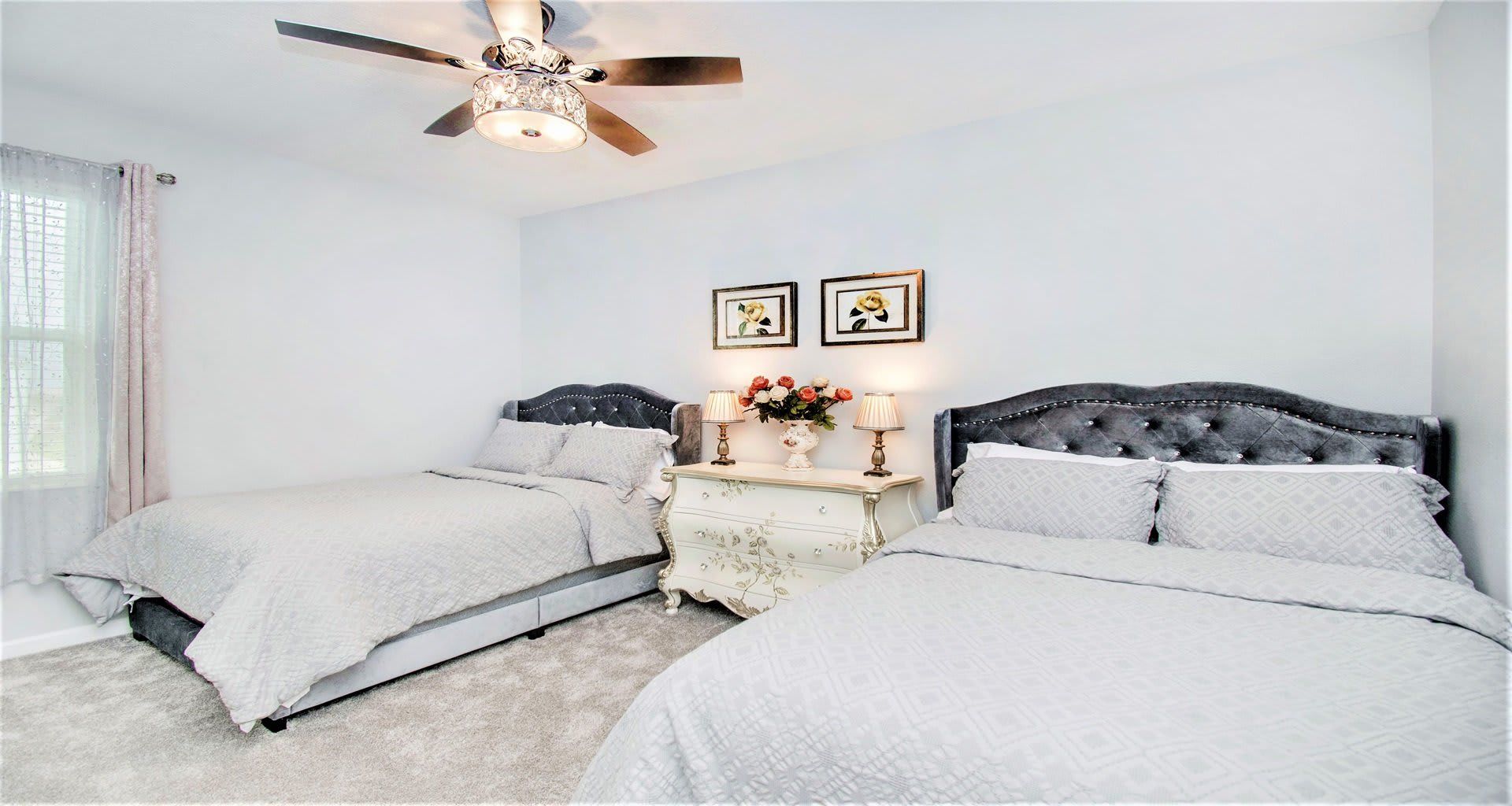 Generous second bedroom with two comfortable full beds, providing ample space for a cozy stay