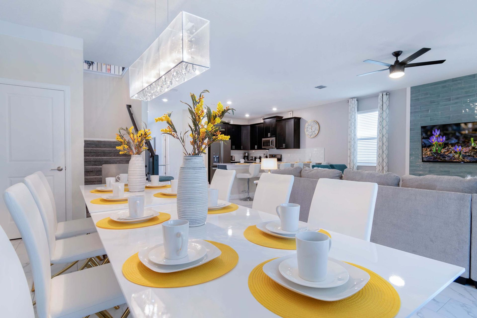 Stylish dining space w/ vibrant decor, modern kitchen & cozy vibes!