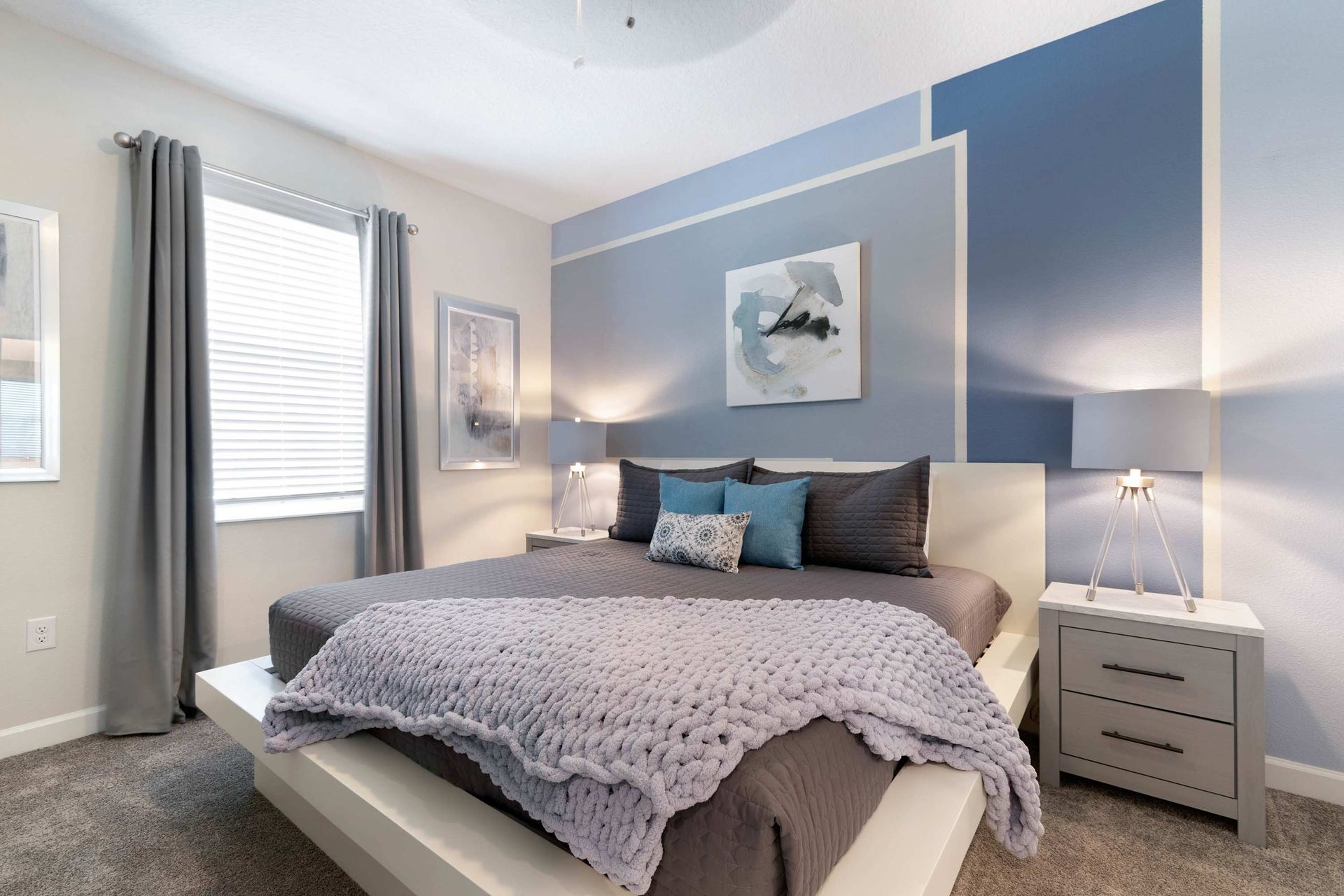 Chic bedroom w/ modern design, cozy linens & calming tones!