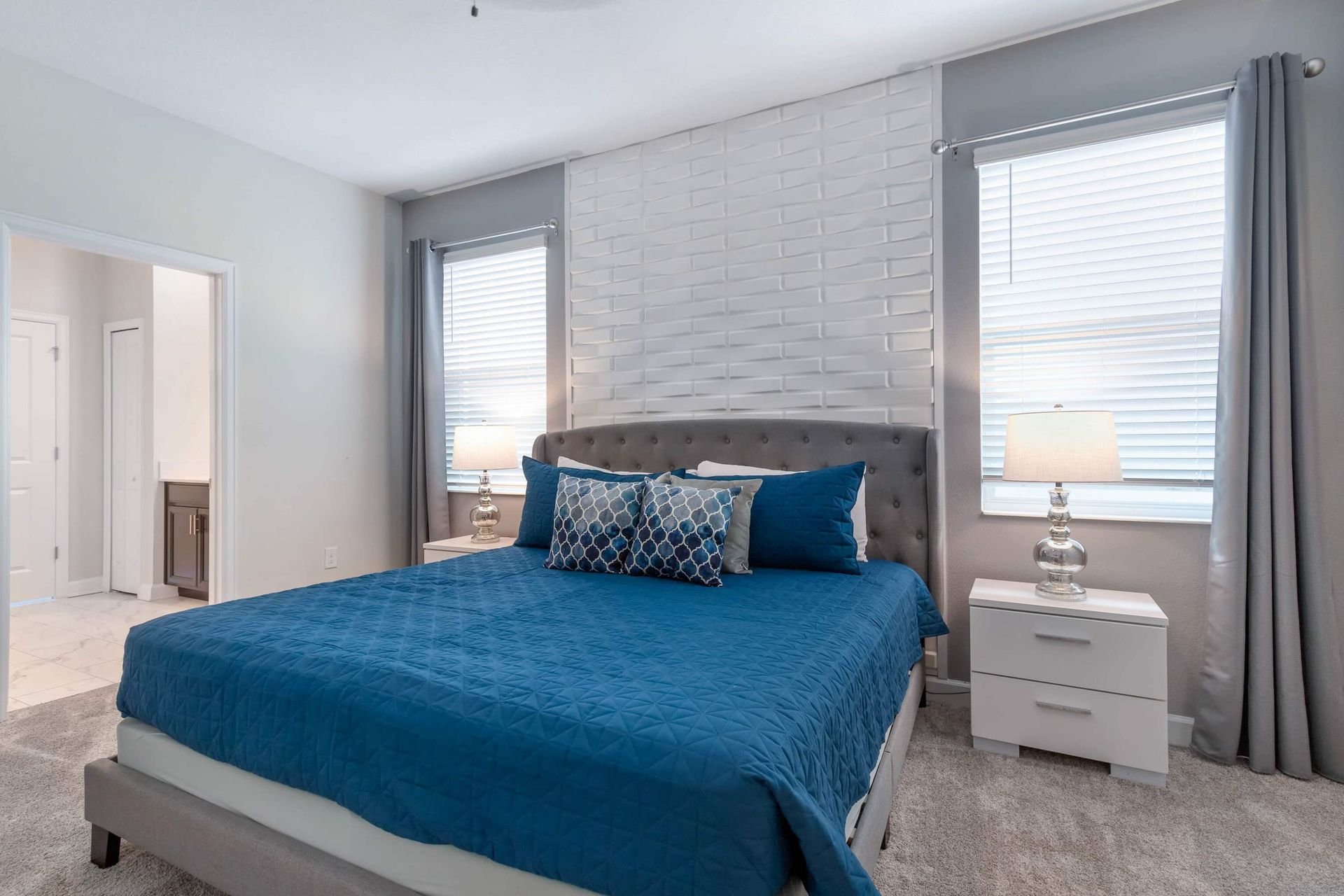 Relaxing bedroom w/ plush king bed, modern accents & soft lighting!