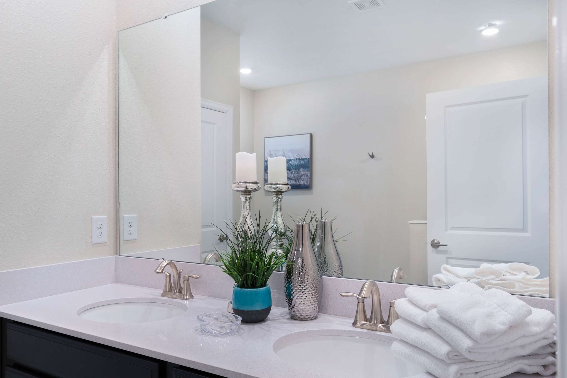 Bright, elegant bathroom w/ dual sinks, chic decor & fresh vibes!