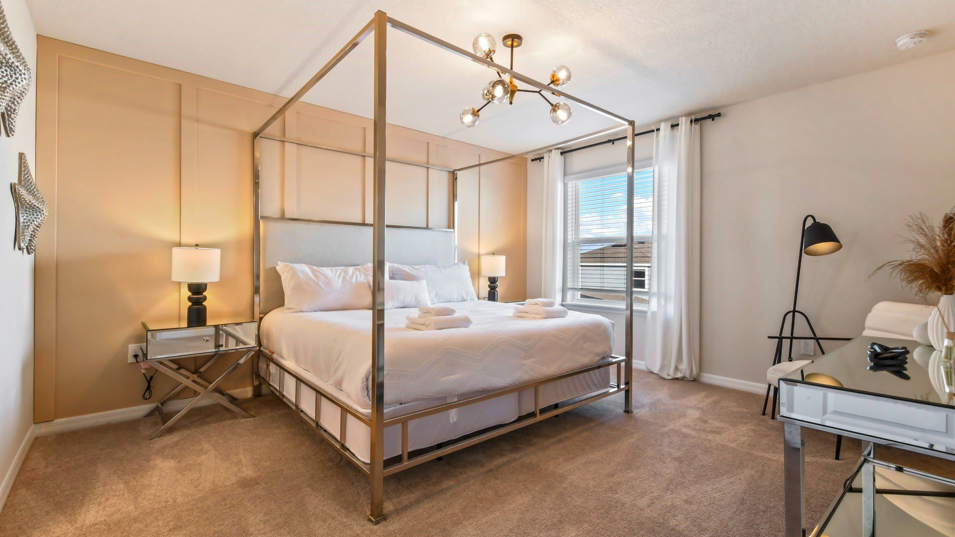 Opulent master bedroom featuring a luxuriously large king bed for a restful and indulgent retreat