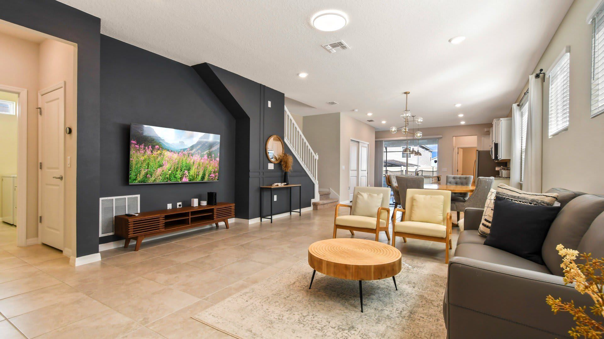 Elegant living room, grandly appointed with a focal TV for luxurious entertainment and relaxation