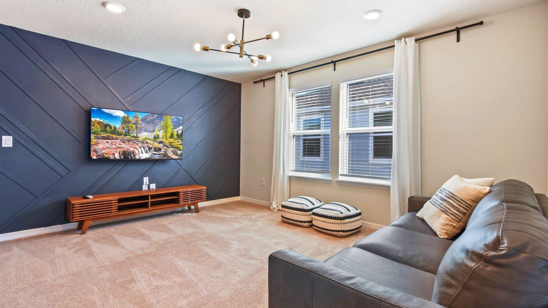 Elegant living room, grandly appointed with a focal TV for luxurious entertainment and relaxation