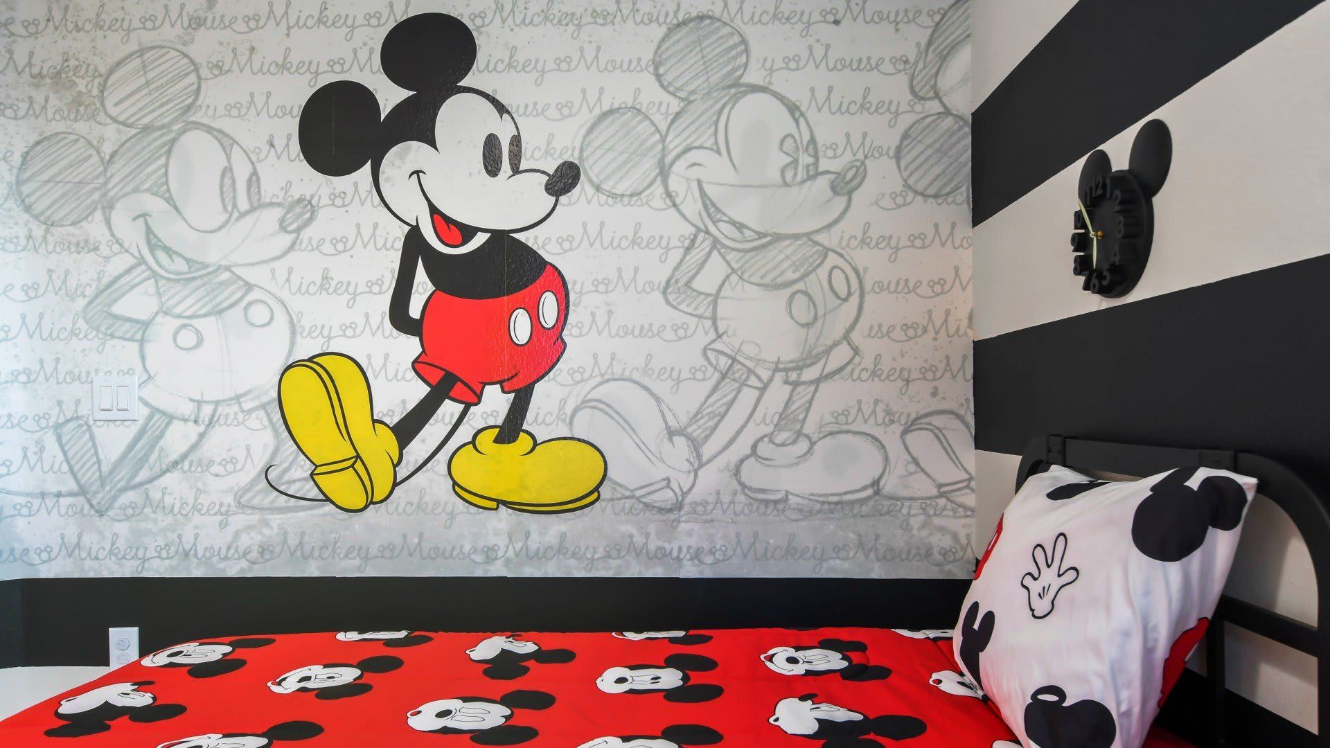 Whimsical Mickey and Minnie Mouse-themed bedroom, ideal for two children, creating a magical and playful space