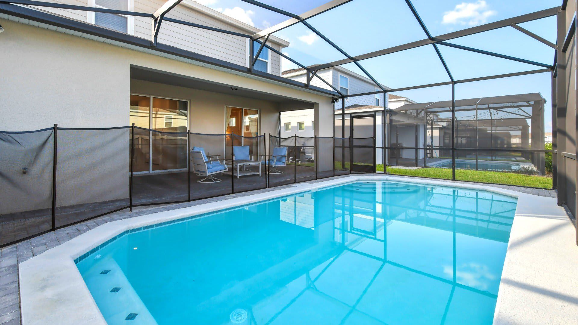 Unwind with family and friends by the screened pool for a relaxing and enjoyable time together