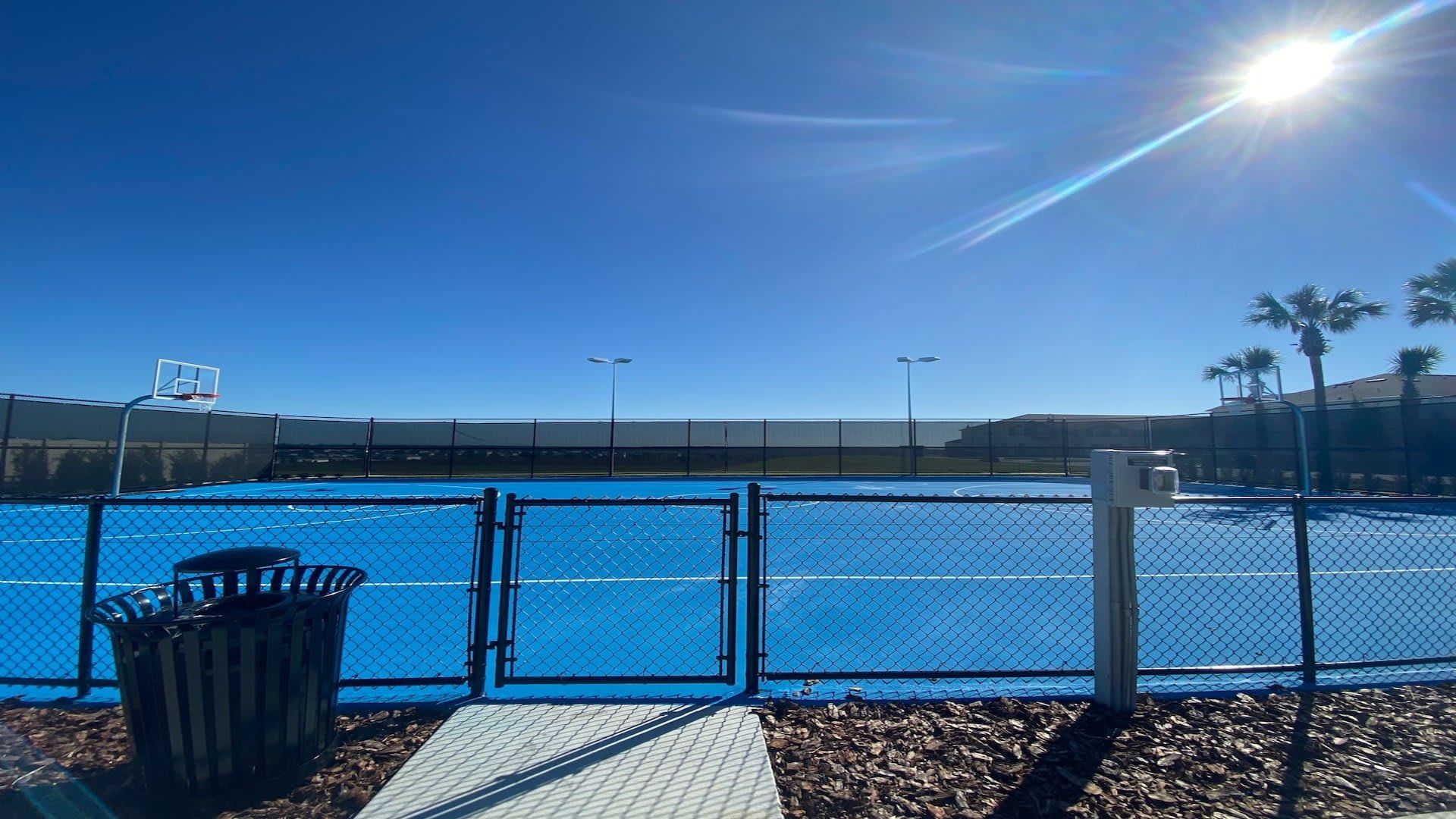 Resort Amenities - Resort basketball court, inviting guests to enjoy a game amidst the scenic surroundings