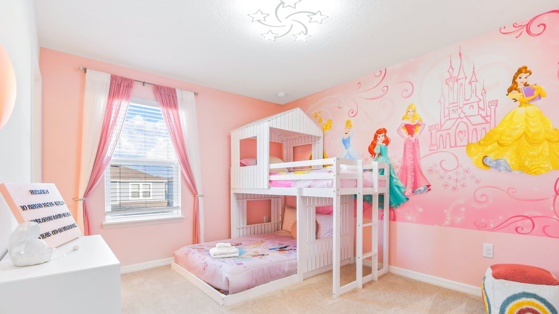Rose-themed Royal Chamber ideal for three youngsters featuring a distinctive bunk bed arrangement
