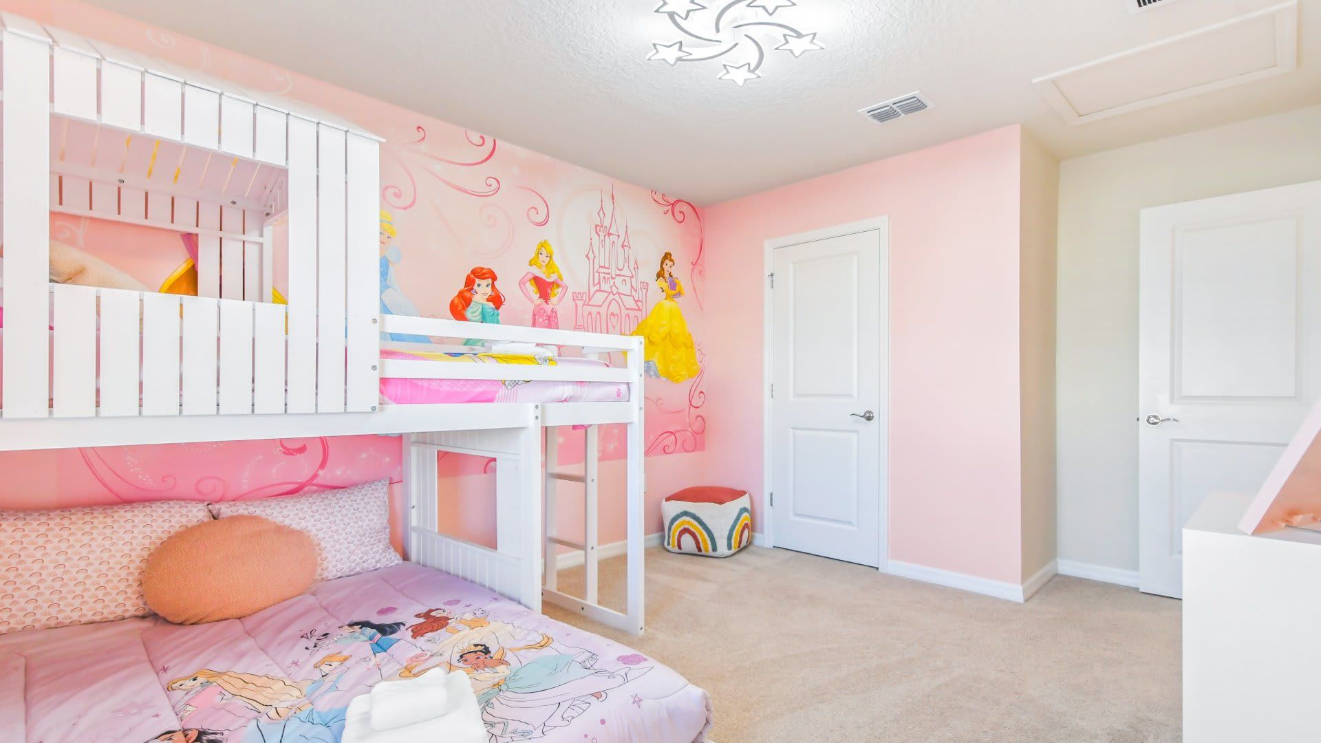 Rose-themed Royal Chamber ideal for three youngsters featuring a distinctive bunk bed arrangement