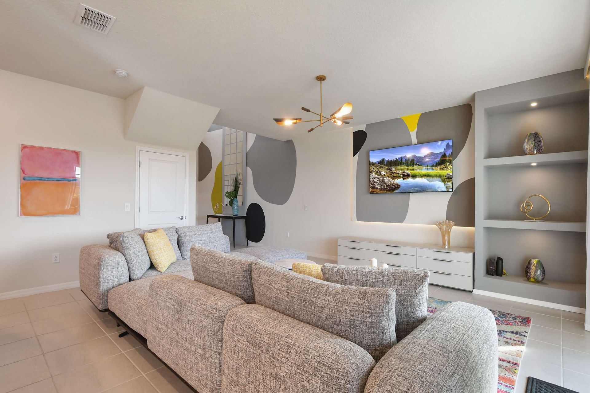 Enjoy quality time with loved ones in our inviting living room, offering a cozy space for relaxation.