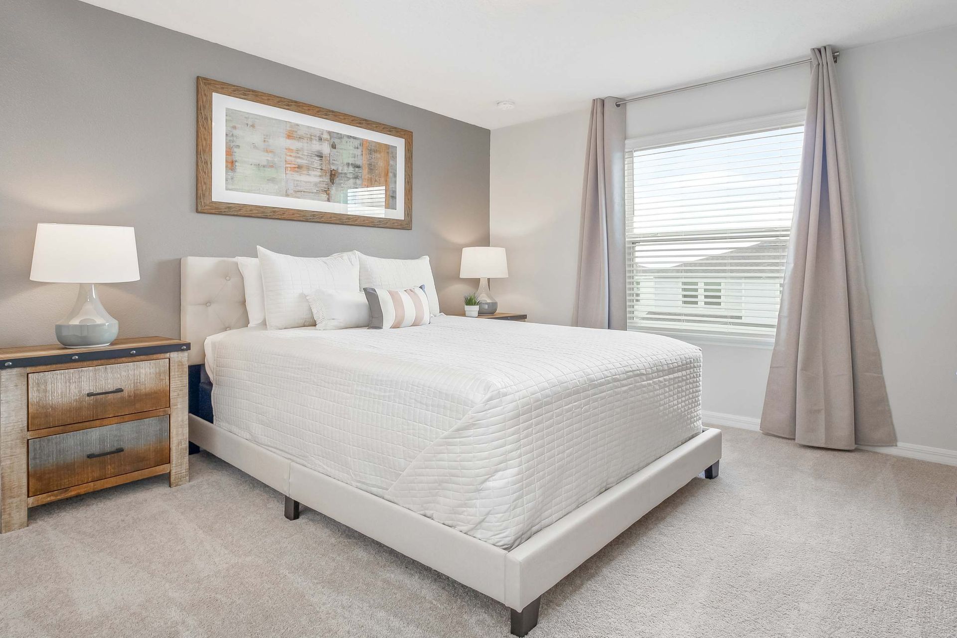 Serene queen bedroom, providing tranquility with the added comfort of a TV for peaceful relaxation