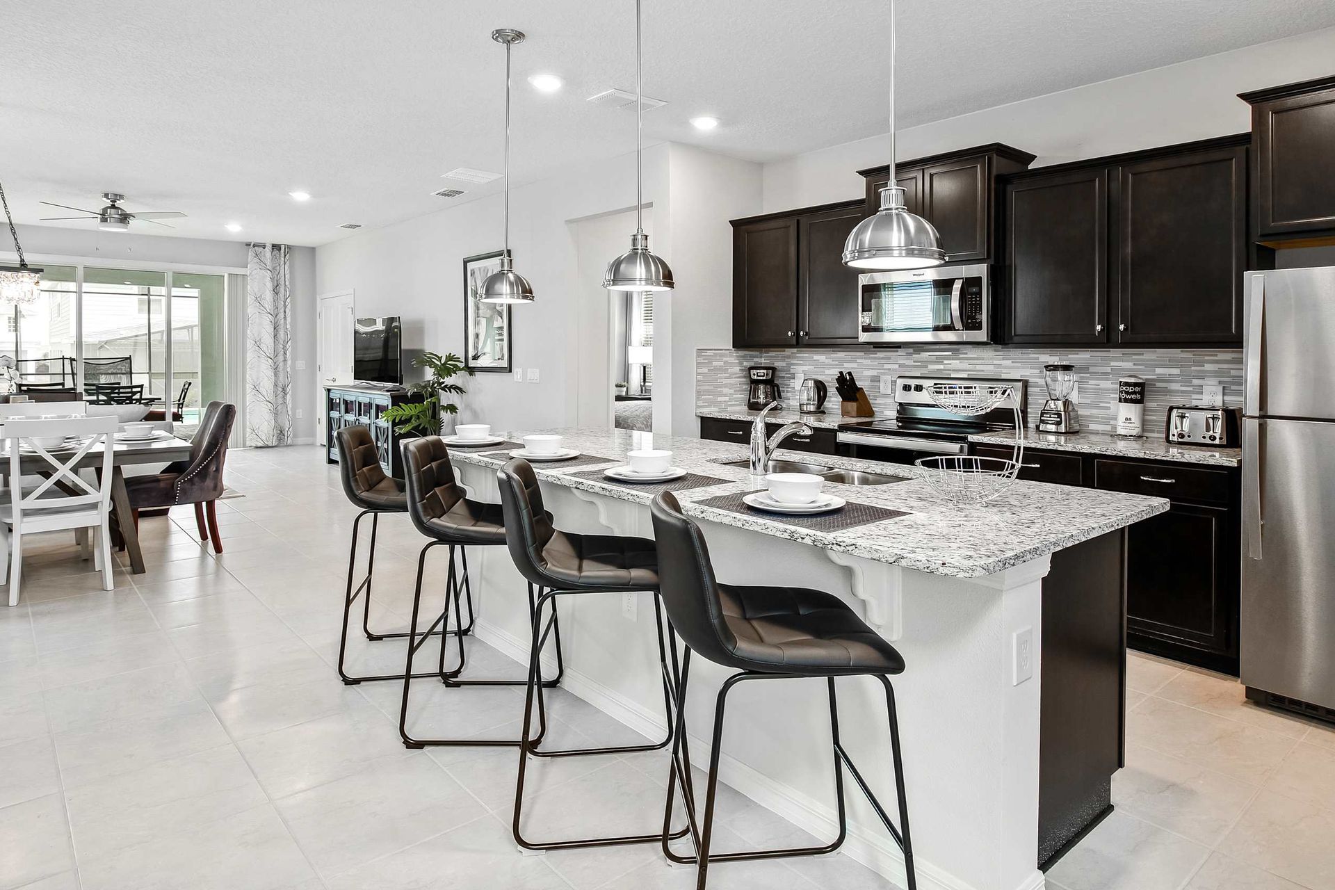 Compact kitchen, featuring a charming mini breakfast bar for cozy morning gatherings