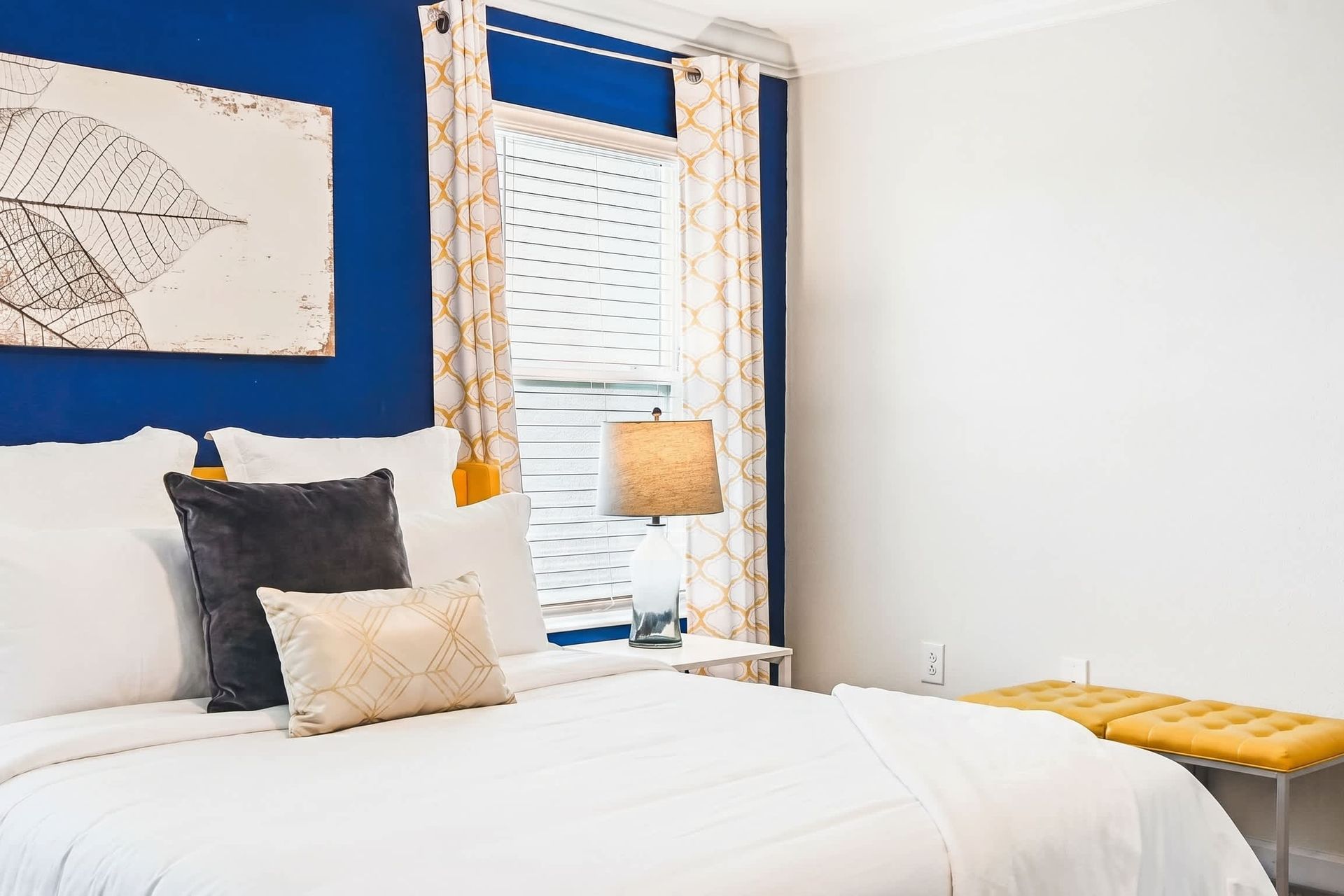 Sleek and pristine king bedroom exuding cleanliness and sophisticated simplicity