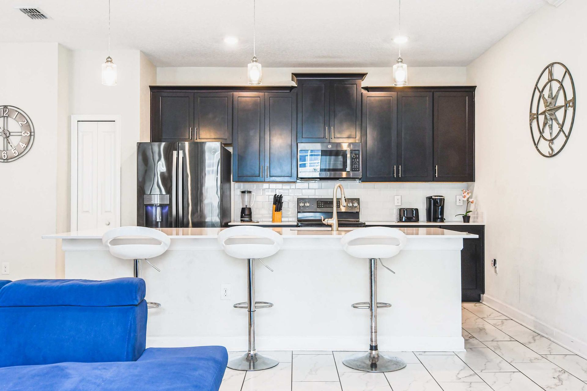 Compact kitchen, featuring a charming mini breakfast bar for cozy morning gatherings