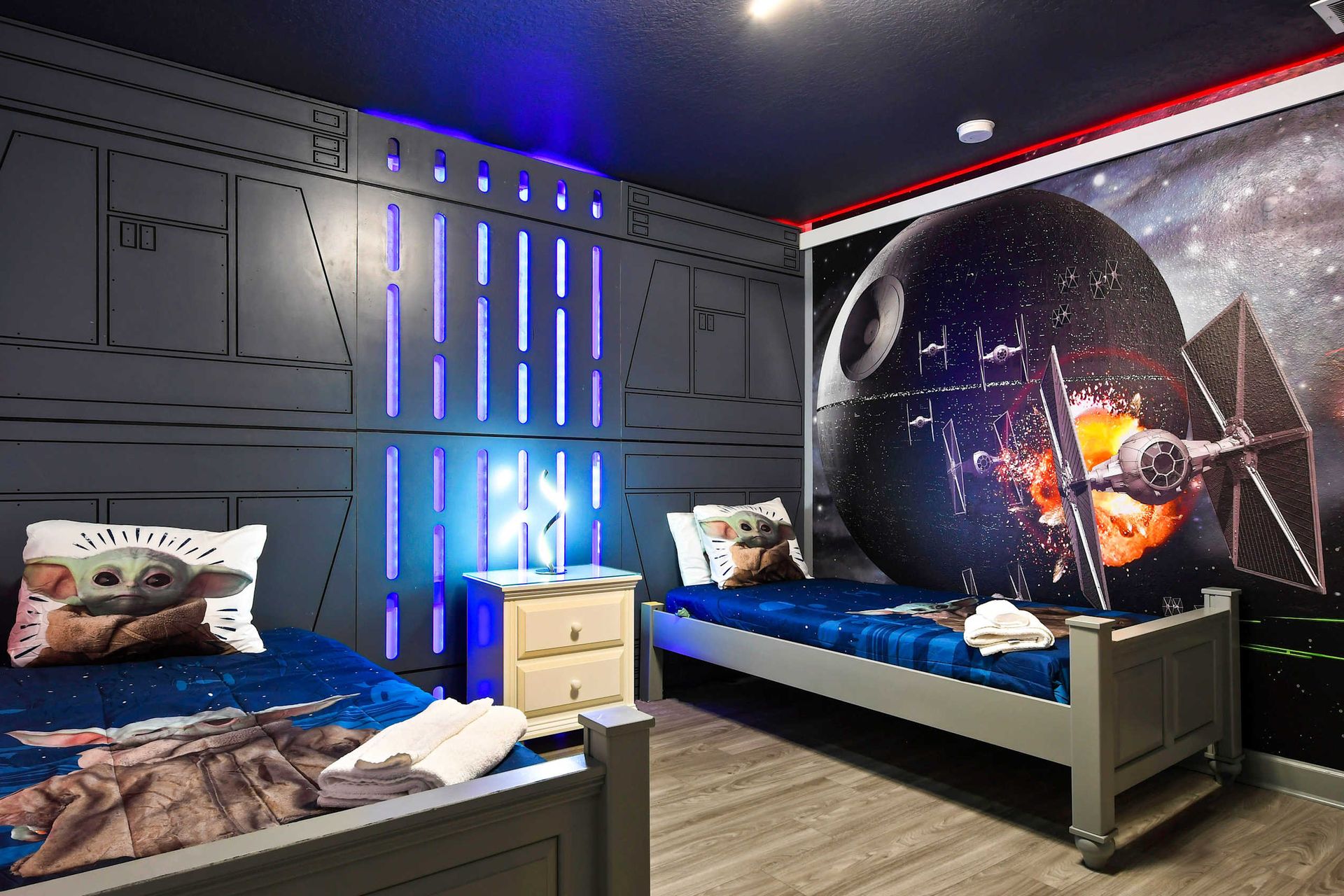 Galactic Star Wars-themed bedroom featuring 2 twin beds, creating an epic space for young fans to enjoy