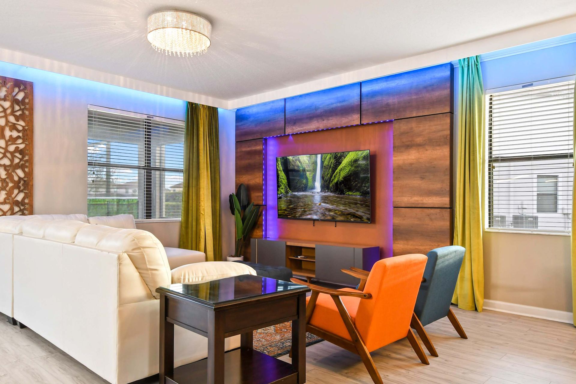 Freshly updated living room, complete with a flat-screen TV and inviting couches for a cozy and modern atmosphere