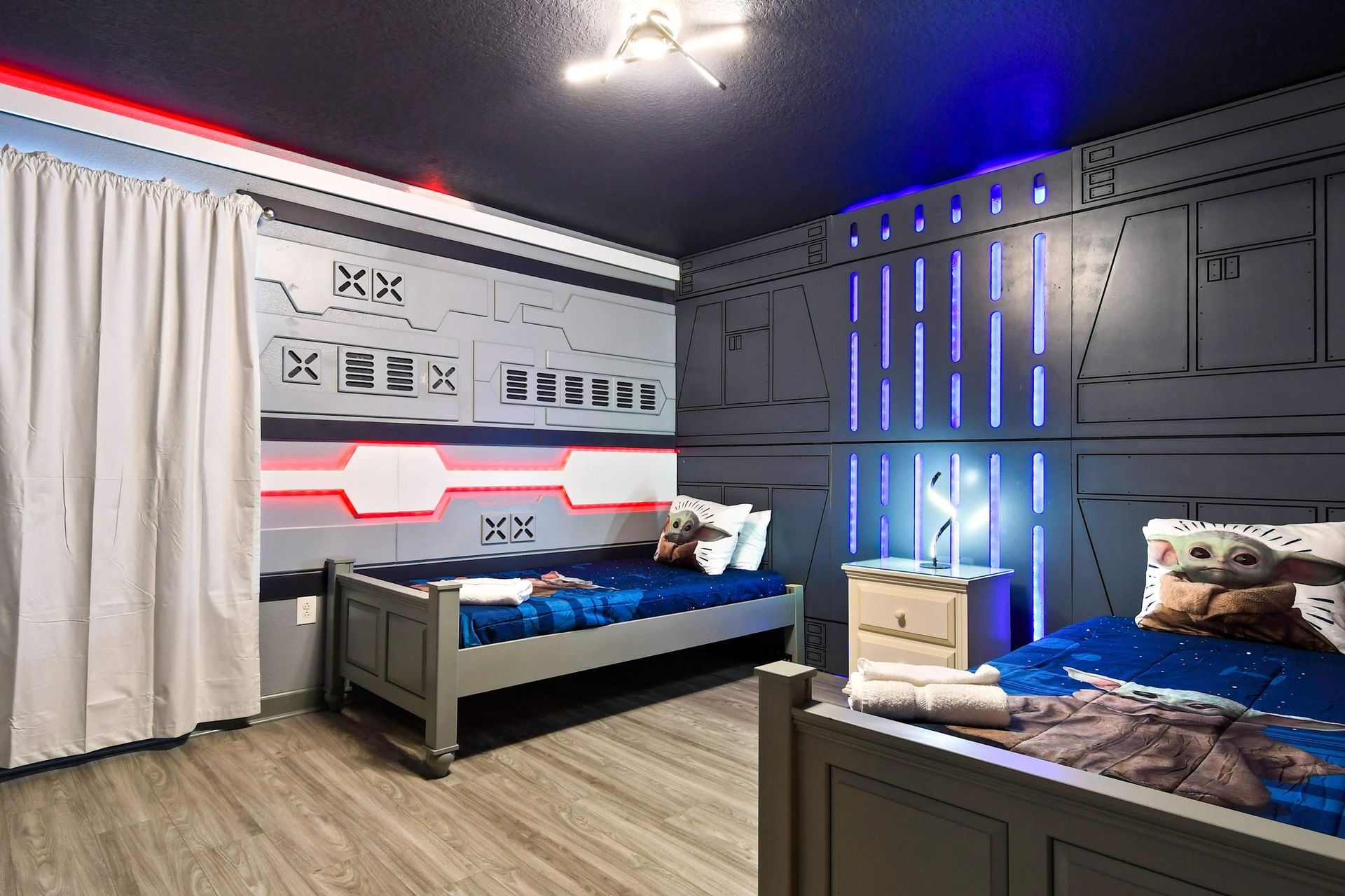 Galactic Star Wars-themed bedroom featuring 2 twin beds, creating an epic space for young fans to enjoy