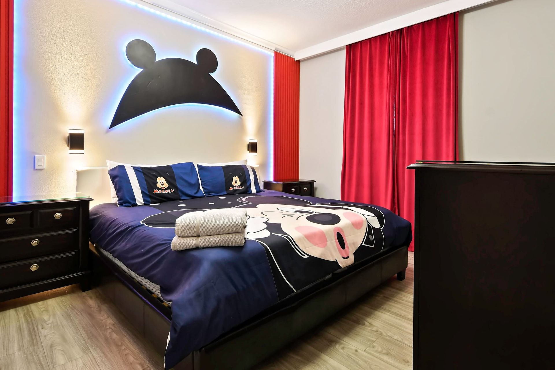 Regal Mickey Mouse-themed king bedroom, blending royal comfort with the whimsy of beloved characters