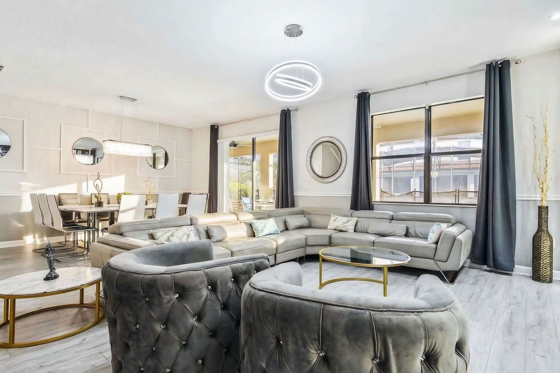 Elegant living room, grandly appointed with a focal TV for luxurious entertainment and relaxation