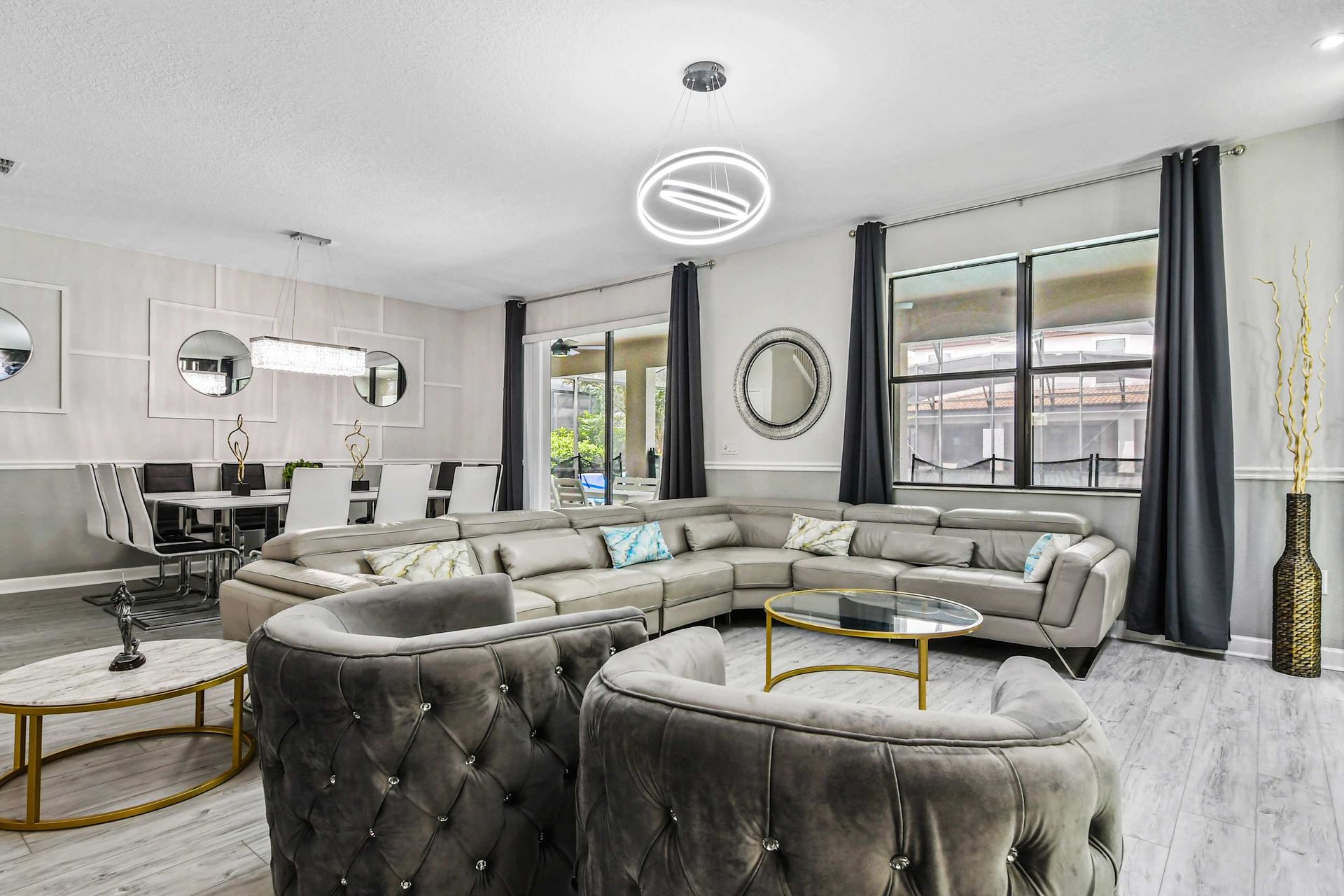 Elegant living room, grandly appointed with a focal TV for luxurious entertainment and relaxation