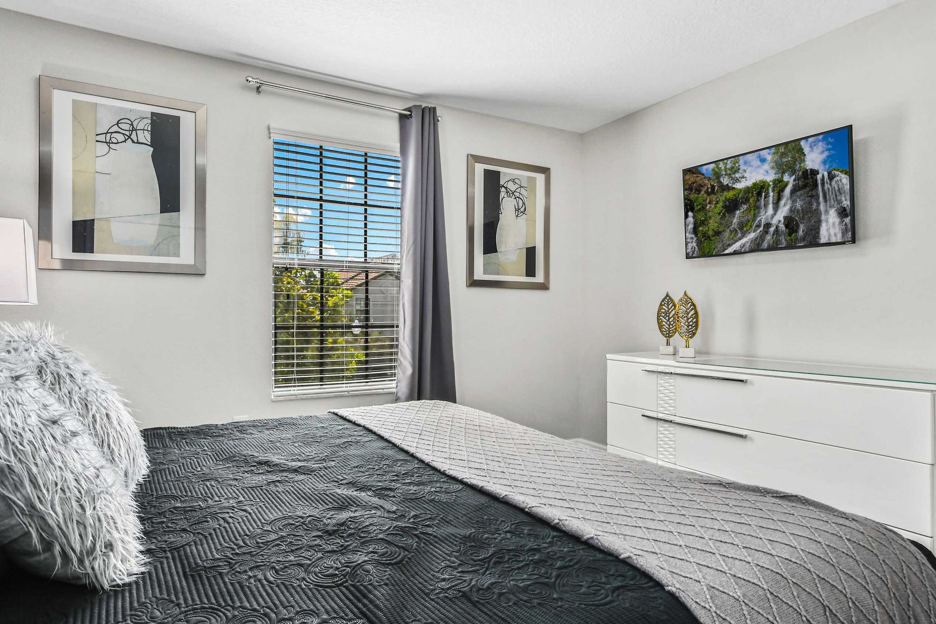 Comfortable king bed in a spacious bedroom, ensuring restful nights and a luxurious atmosphere