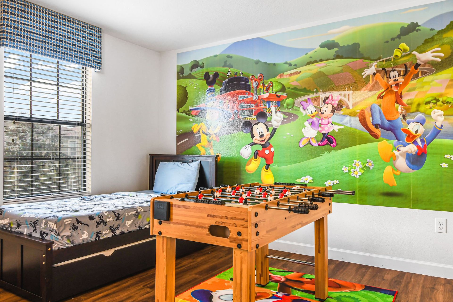 Mickey Mouse-inspired haven featuring a playful touch, plus a foosball corner for added fun