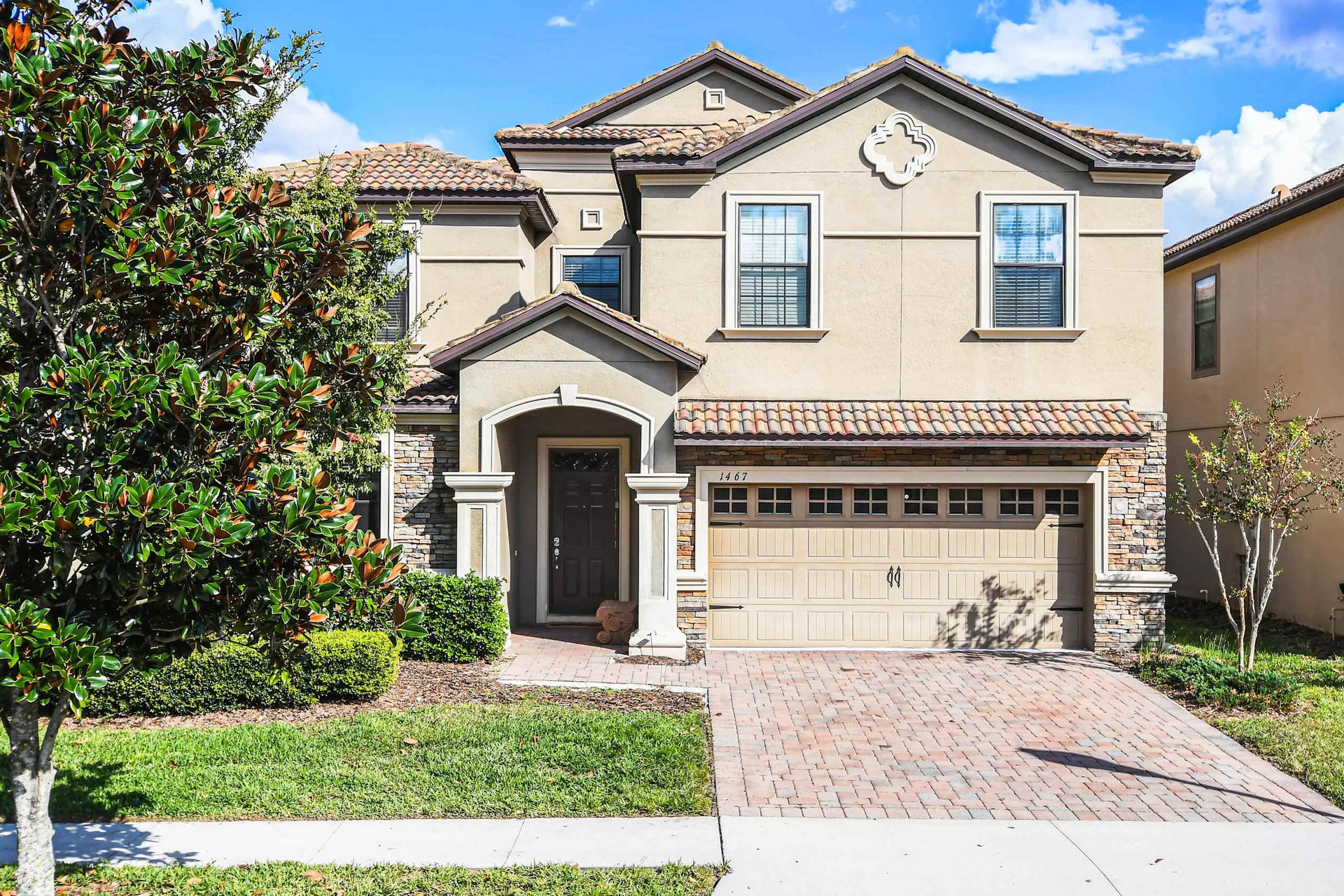 Modern elegance meets lush greenery, creating a harmonious and inviting outdoor space