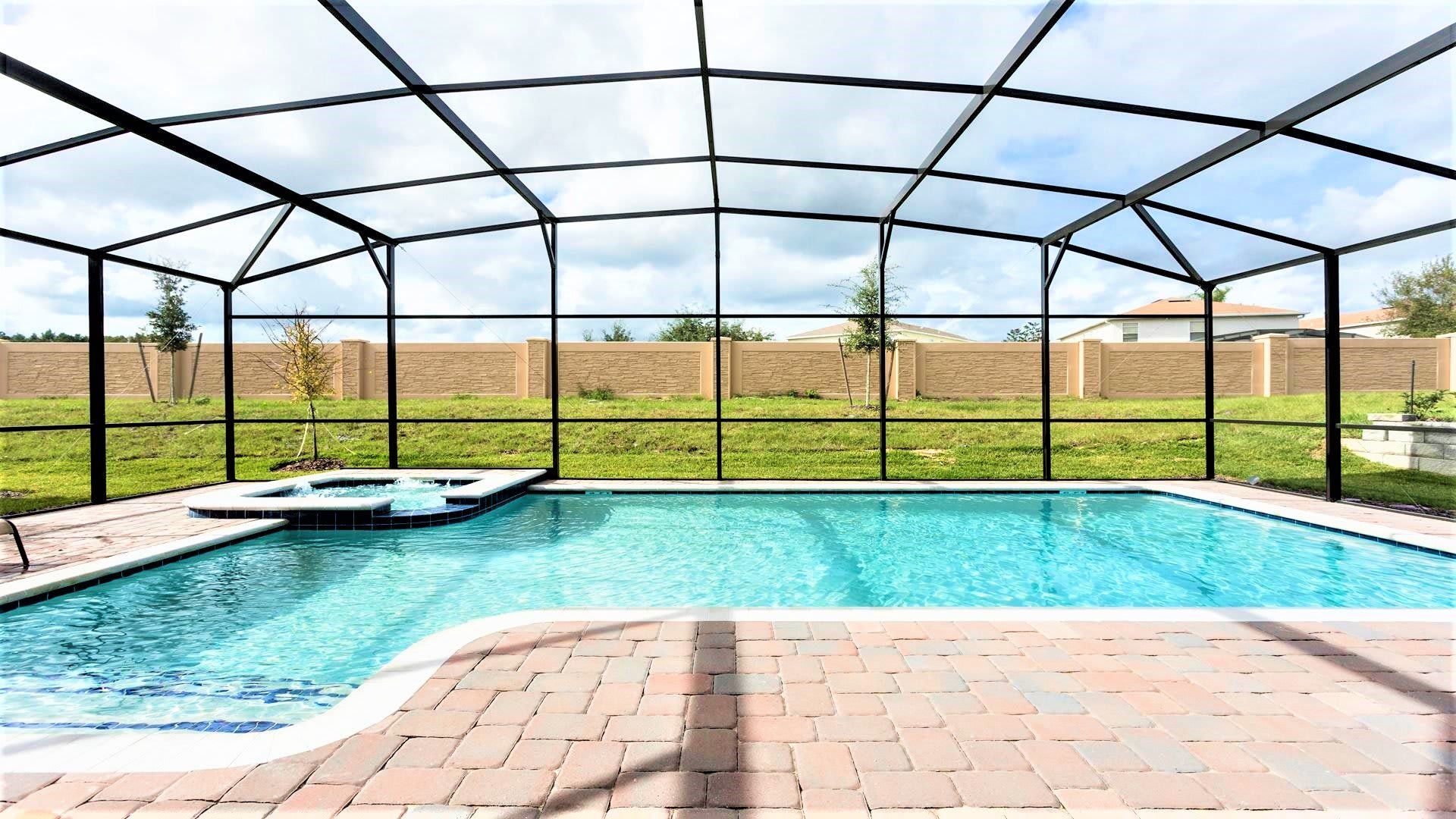 Exclusive use of a screened-in spa and pool ensures a private and serene aquatic retreat just for you