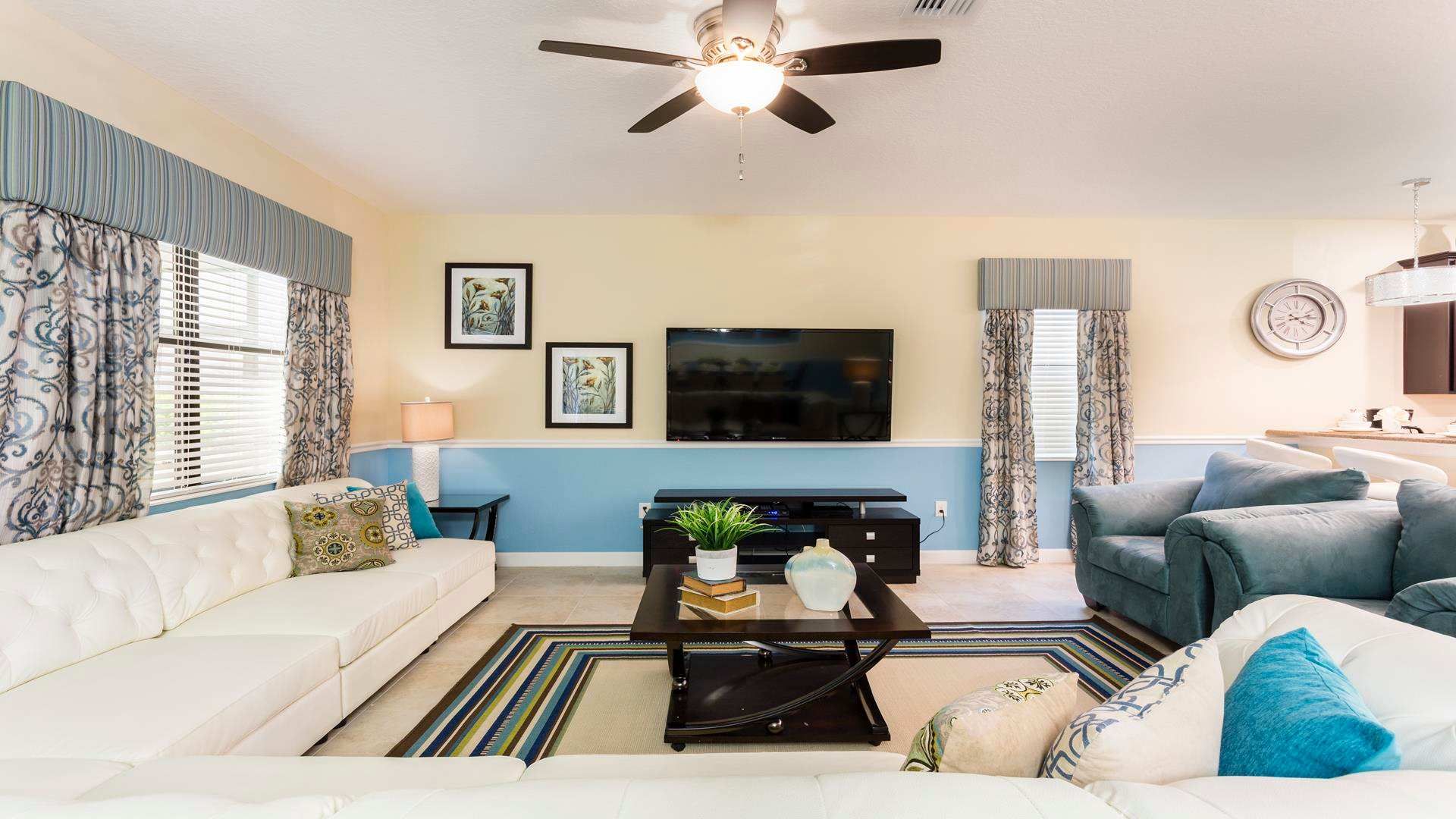 Relax on comfy sofas in the living room, complemented by a television for your entertainment needs