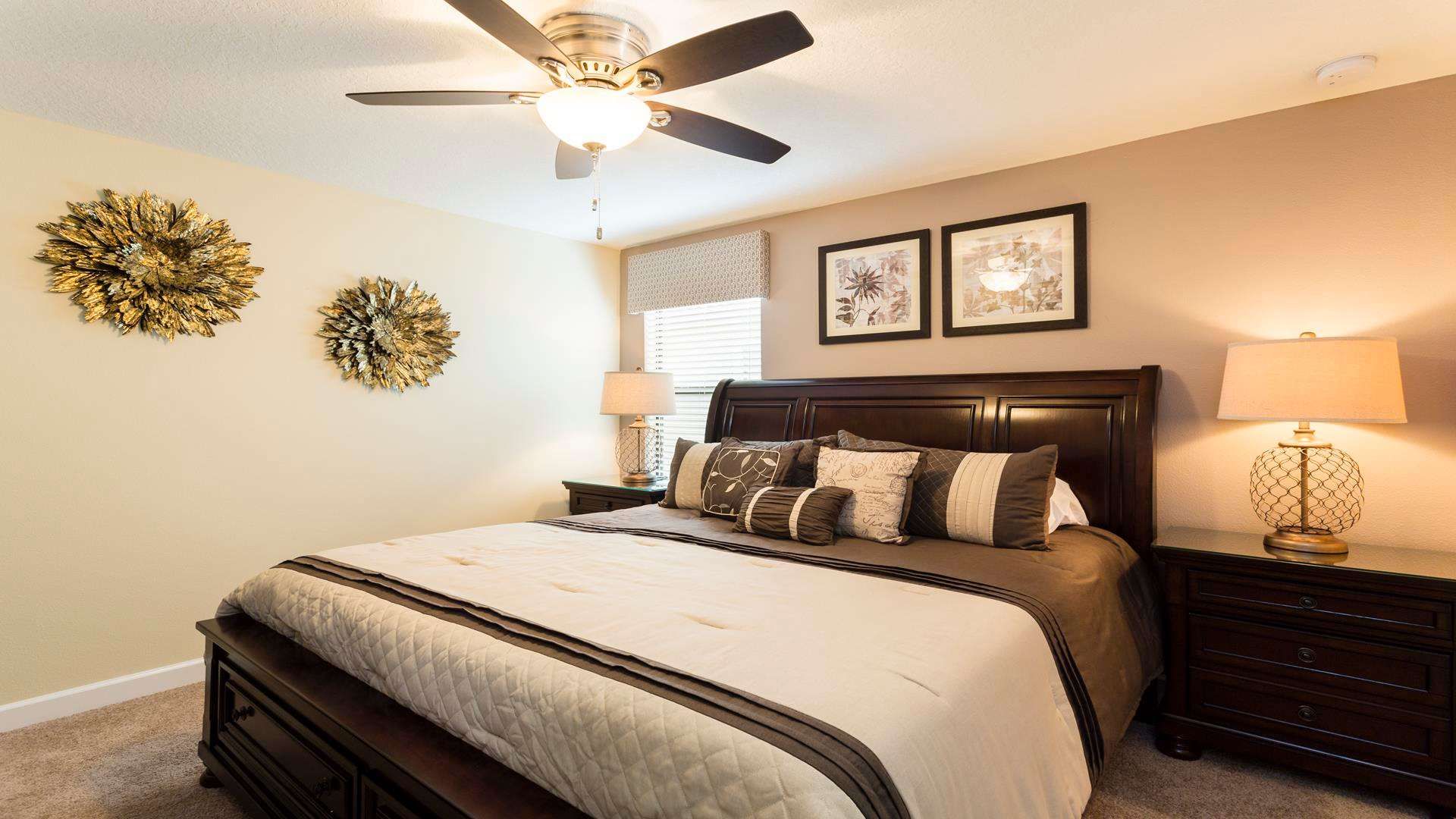 Elegant bedroom with rich dark wood furniture, warm lighting, and stylish gold accents.