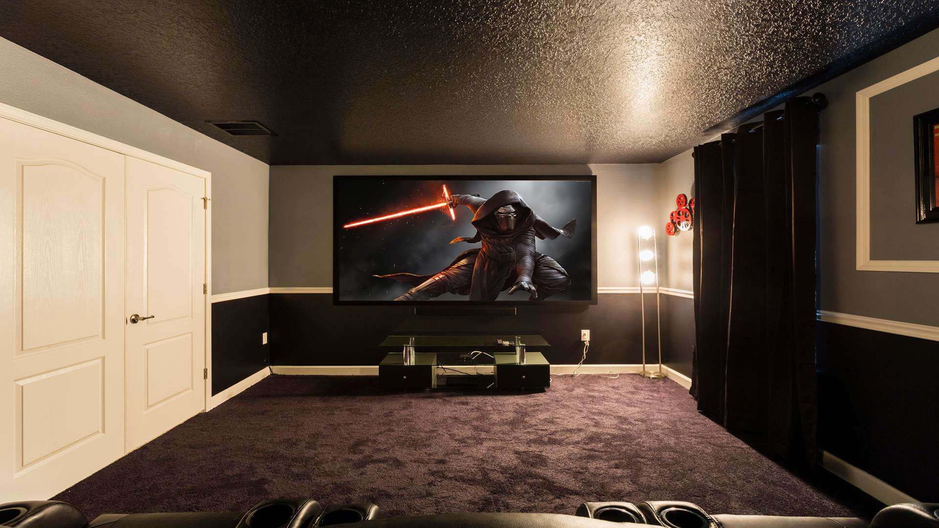 Indulge in the ultimate private cinema experience with loved ones in this expansive theater room