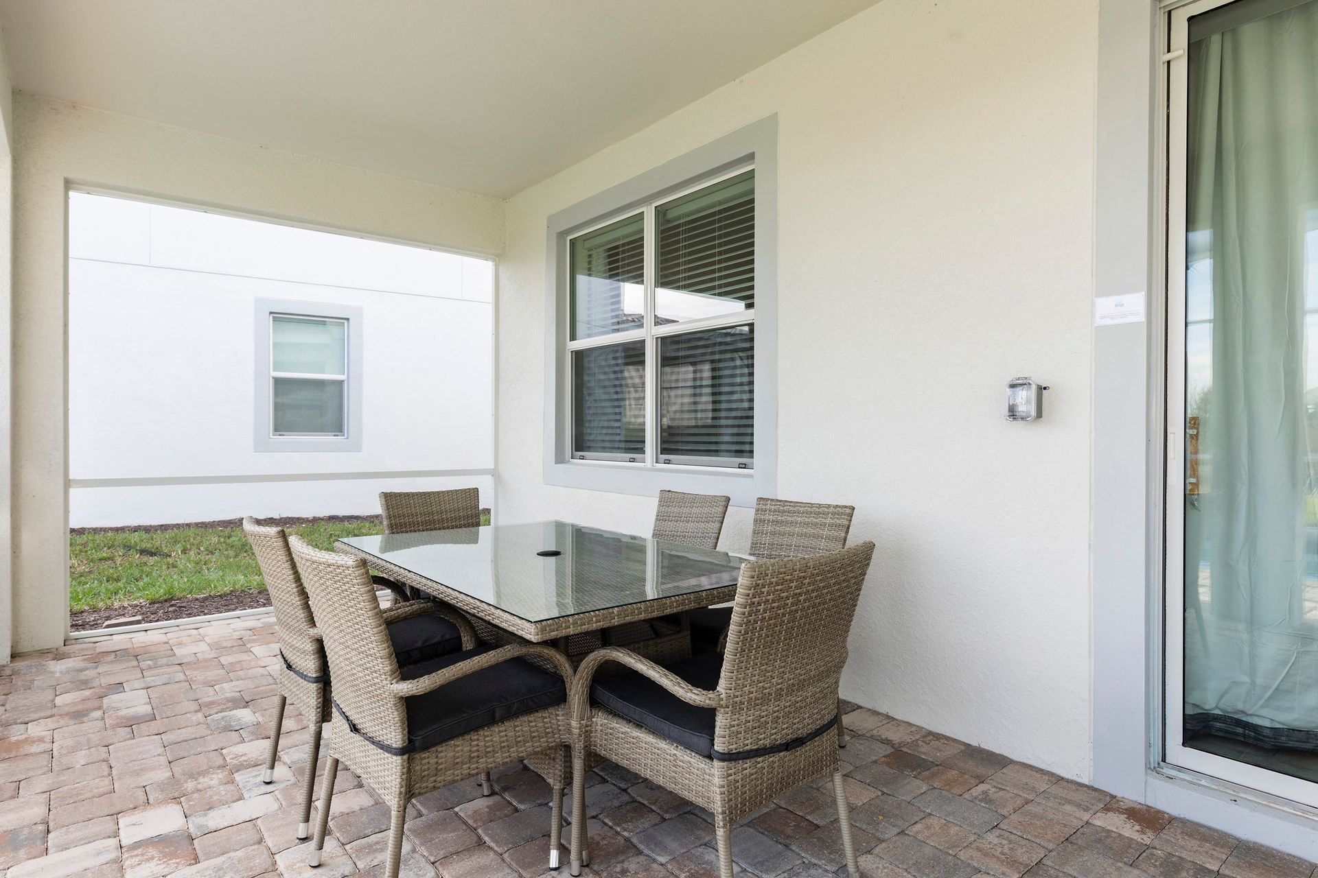 Cozy outdoor patio with dining set, perfect for al fresco meals!