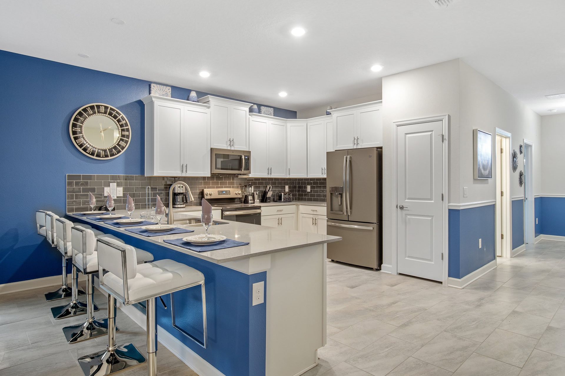 Modern kitchen with stainless appliances, bar seating, and style!