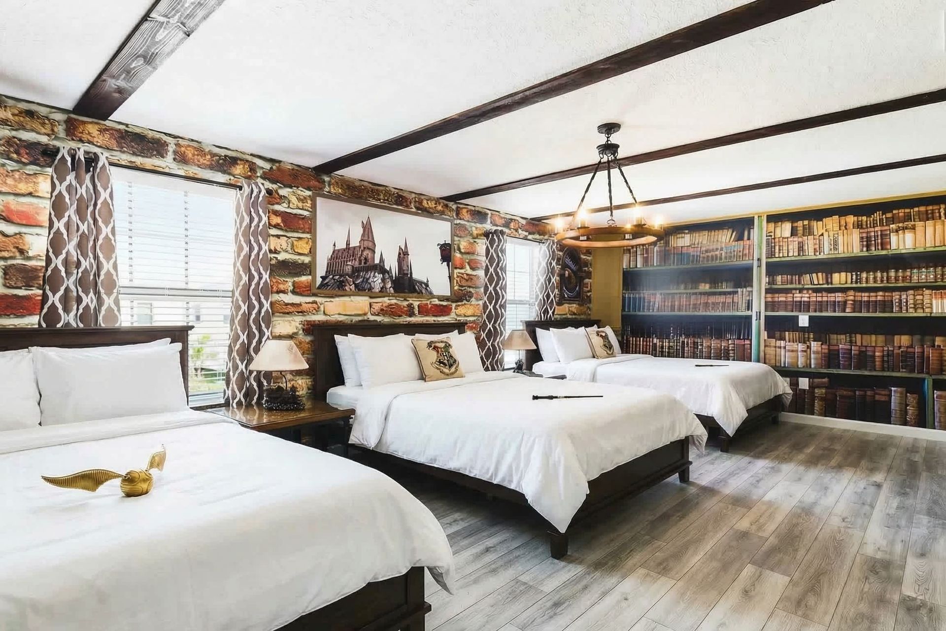 Harry Potter-themed bedroom featuring three full-sized beds.