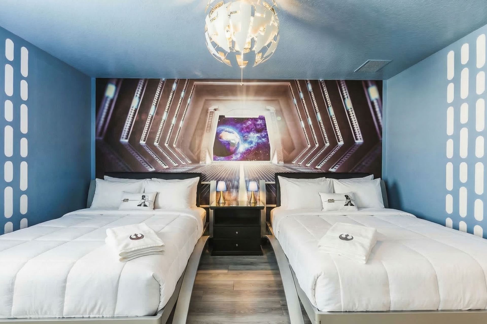 Epic Star Wars-themed bedroom with twin beds and galactic decor—perfect for young Jedi fans!