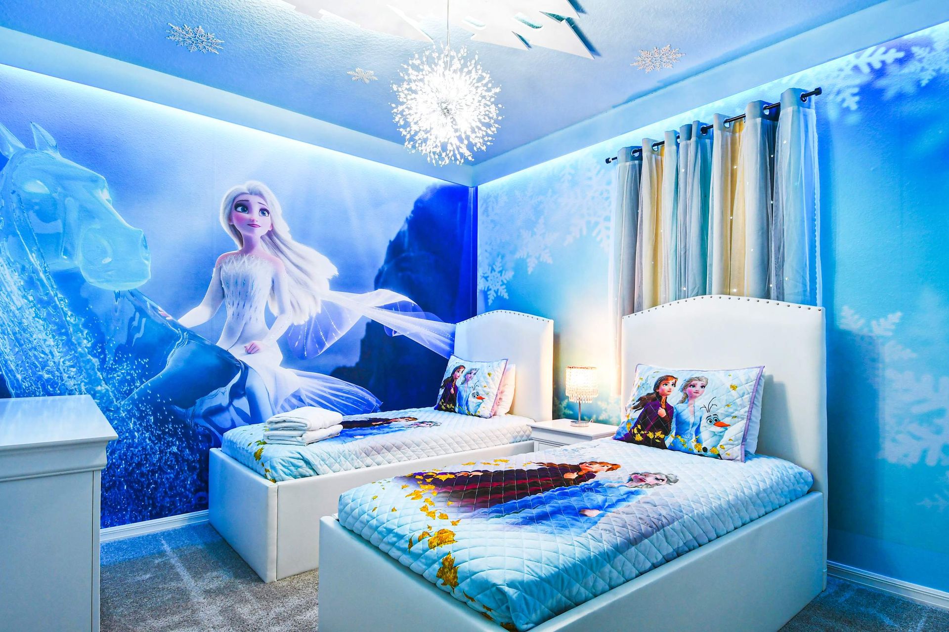 Immerse in Frozen enchantment with a room adorned in icy decor, creating a magical and frosty ambiance