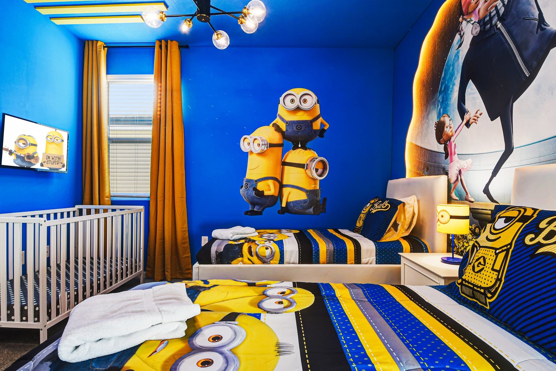 Delightful Minion-inspired room, featuring whimsical decor, perfect for a child with a crib for added comfort