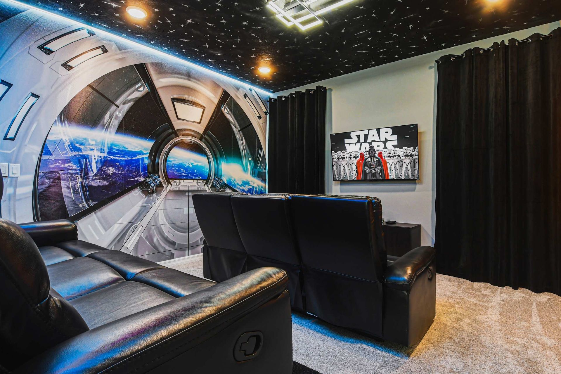 Galaxy-themed home theater with plush seating and immersive sci-fi decor.