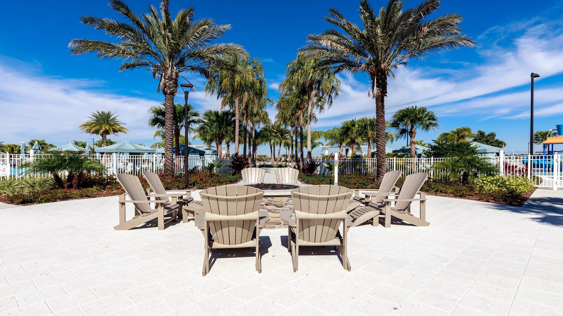 Gather around the warmth in style with comfortable seating at the resort's inviting firepit area