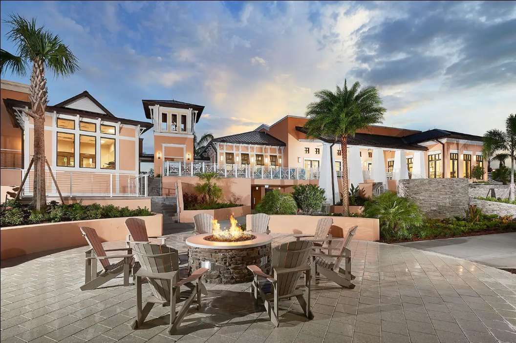 Gather around the warmth in style with comfortable seating at the resort's inviting firepit area