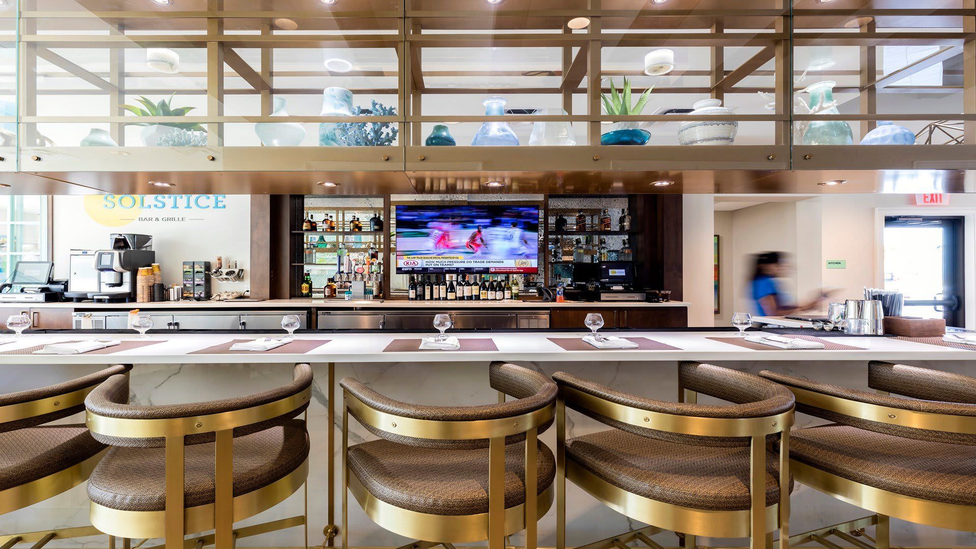 Sip and savor at the lively resort bar, offering a diverse selection of drinks in a vibrant and social atmosphere