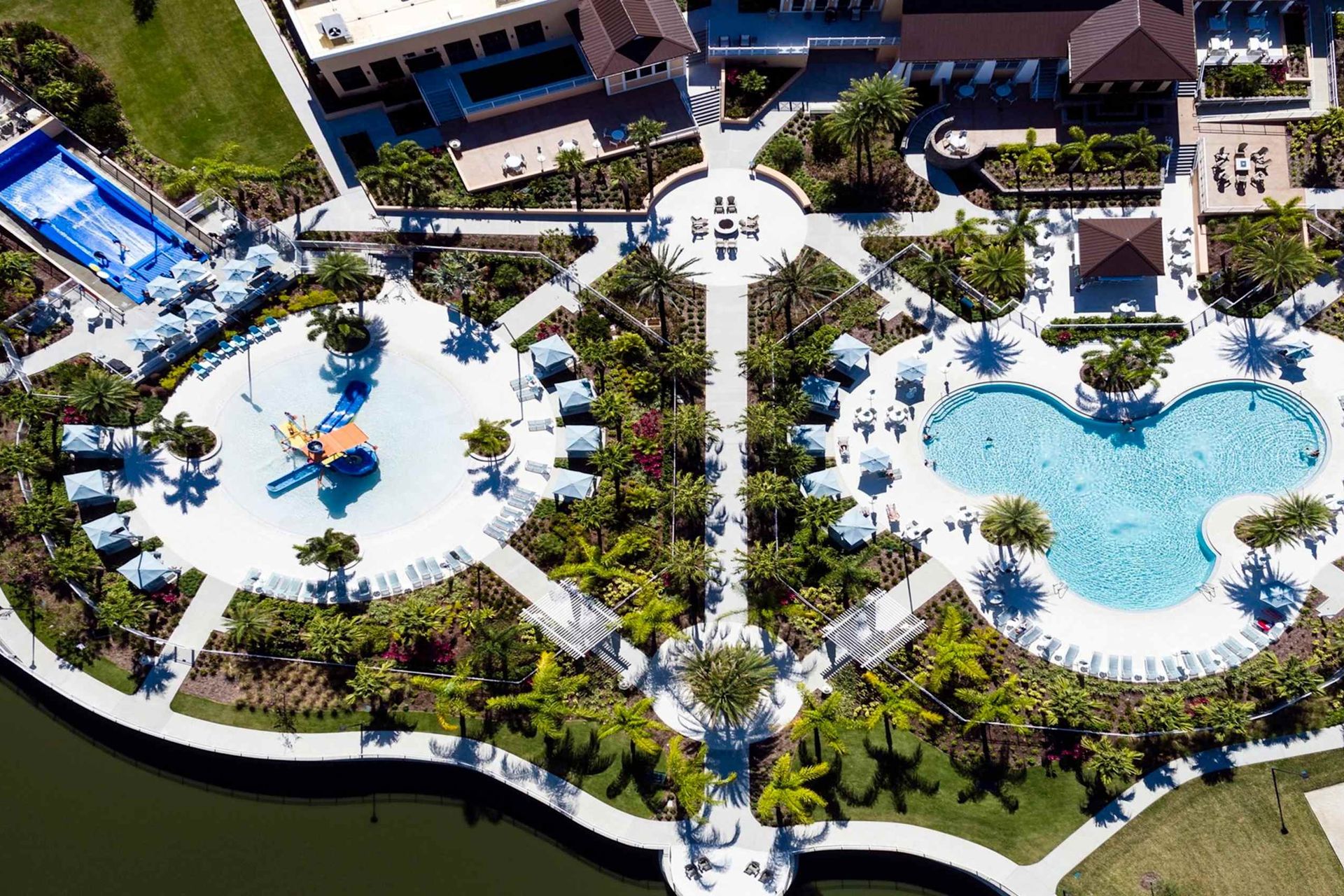 Aerial view of a stunning Solara resort complex with luxurious pools and lush gardens.