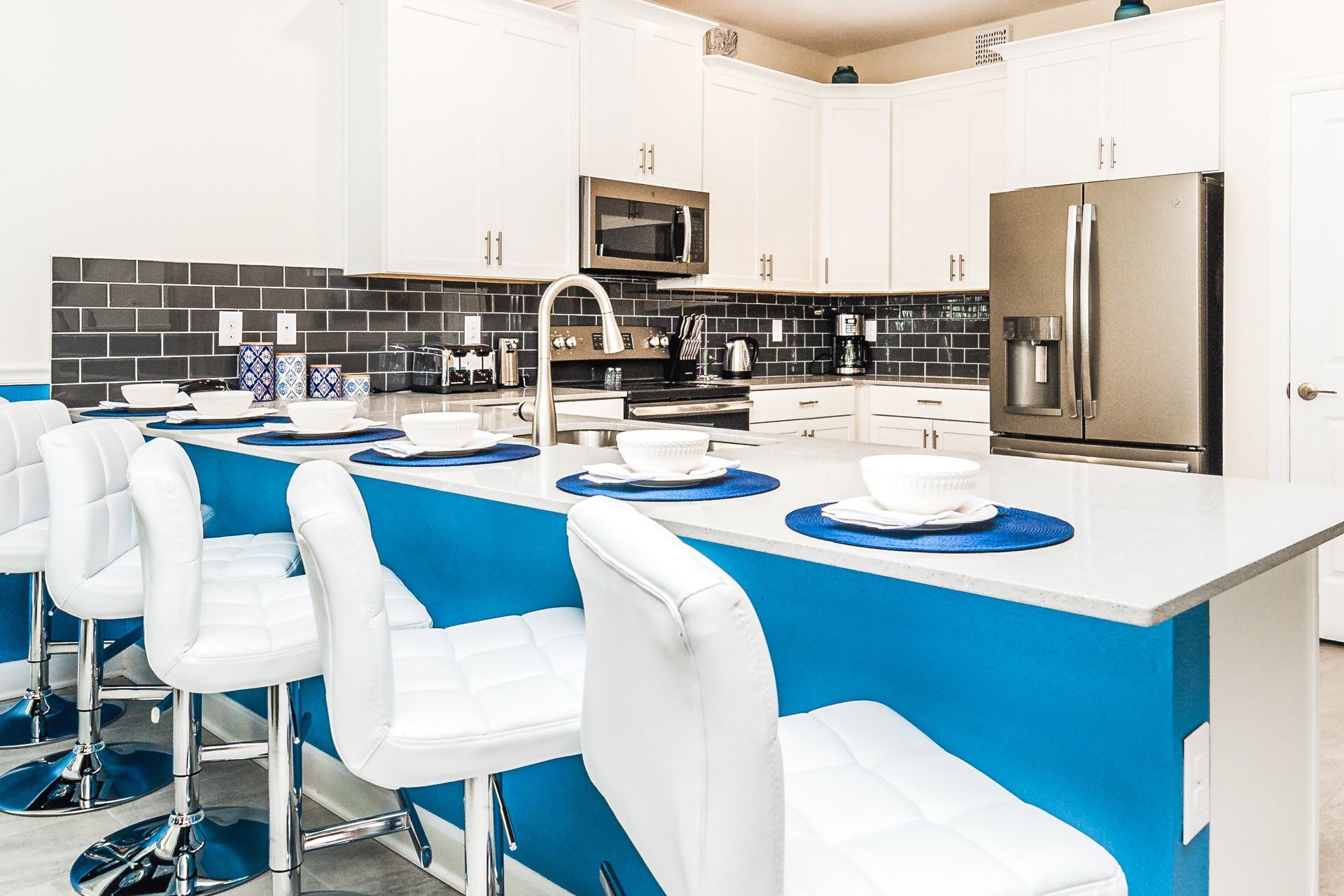 Compact and stylish with a mini breakfast bar, offering a cozy space for quick and casual dining