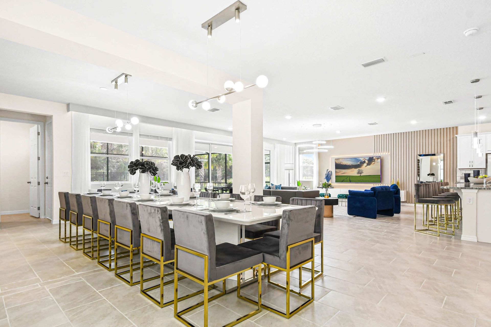 Spacious open-concept dining and living area with modern decor and natural light.