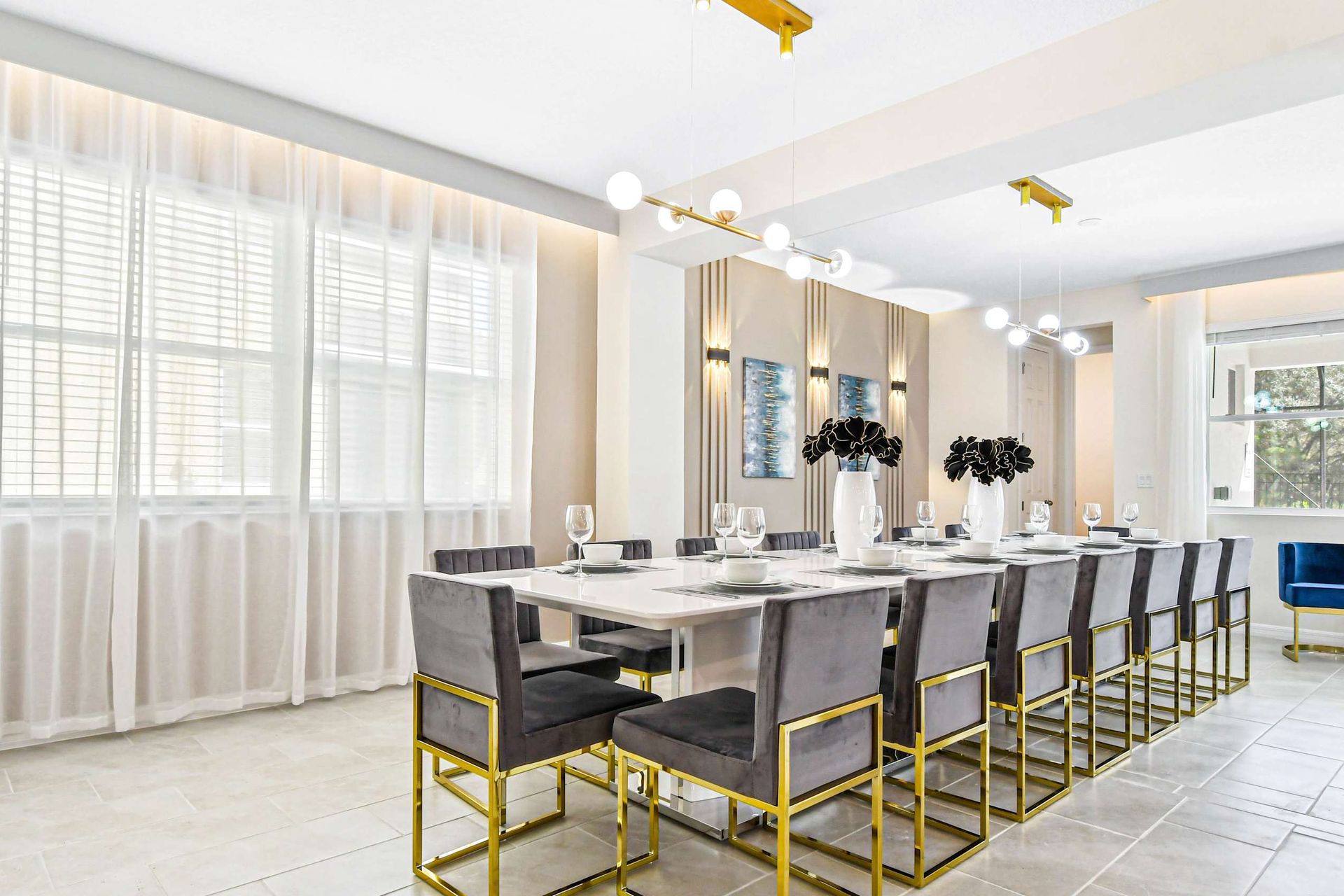 Bright, elegant dining space with seating for 10, modern lighting, and stylish decor.