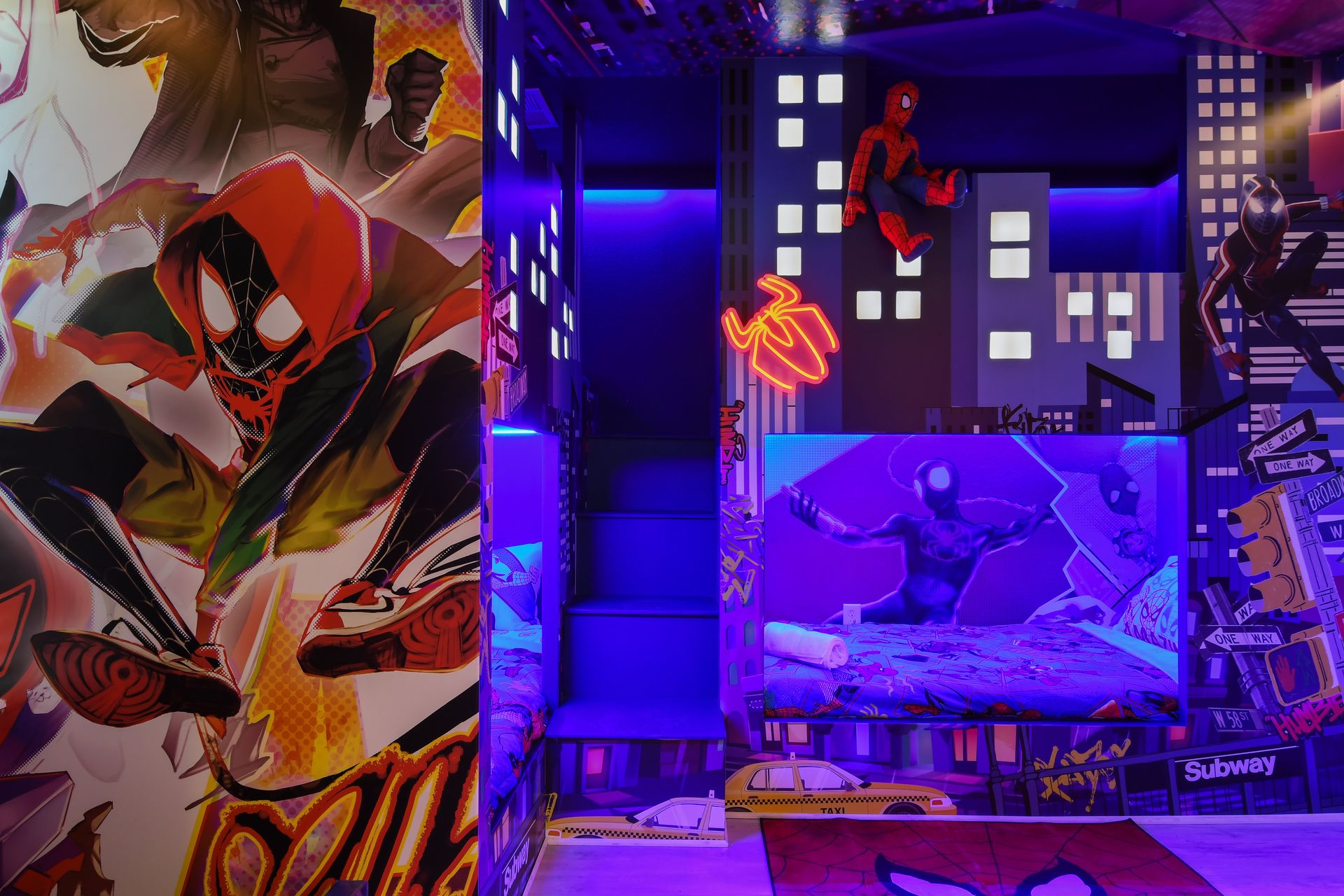 Superhero hideout with bold murals, bunk beds, and Spidey vibes!