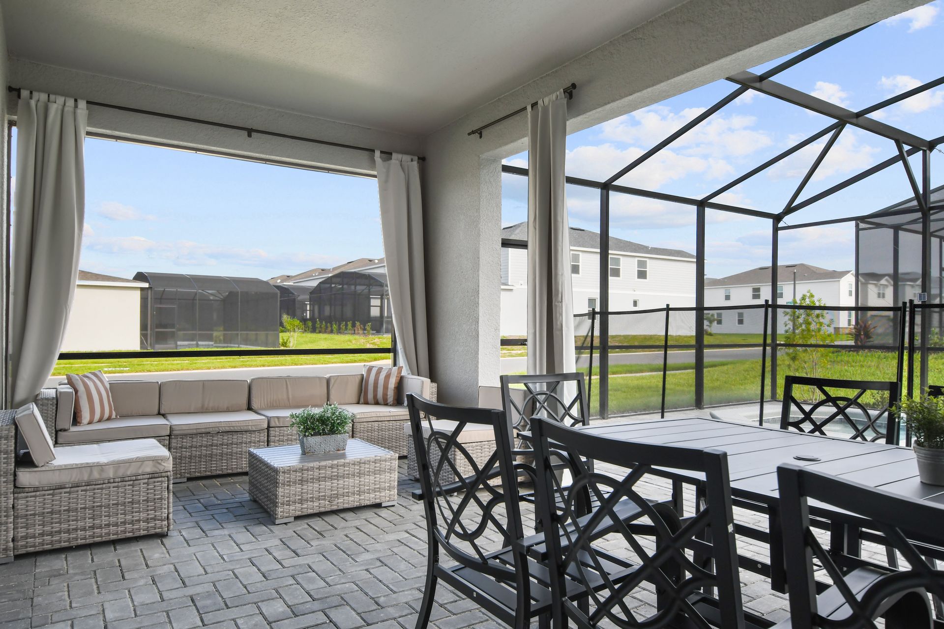 Cozy outdoor lounge area with poolside seating and dining for relaxation.