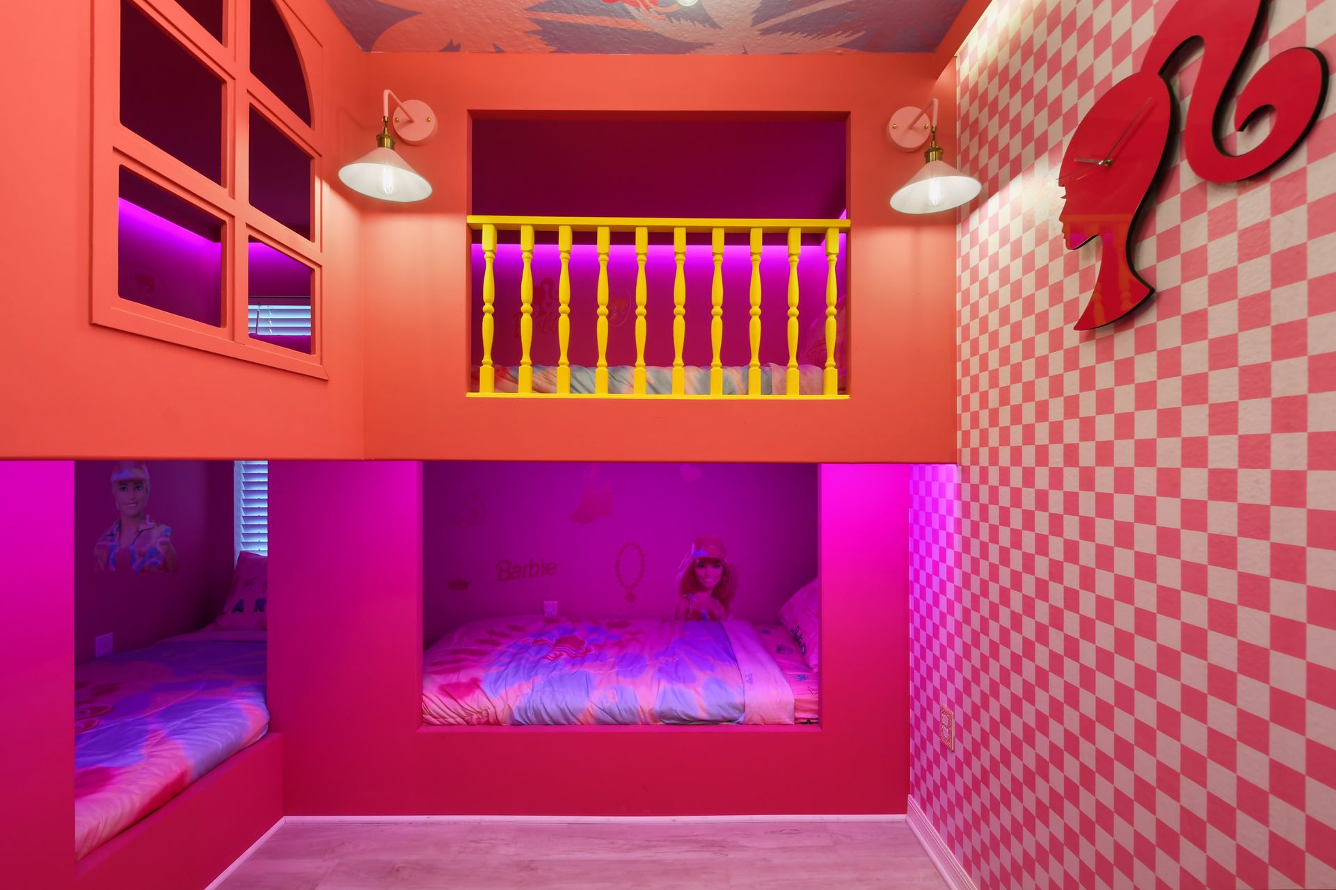 Dreamy Barbie bunk room with vibrant pinks and playful checkered accents!